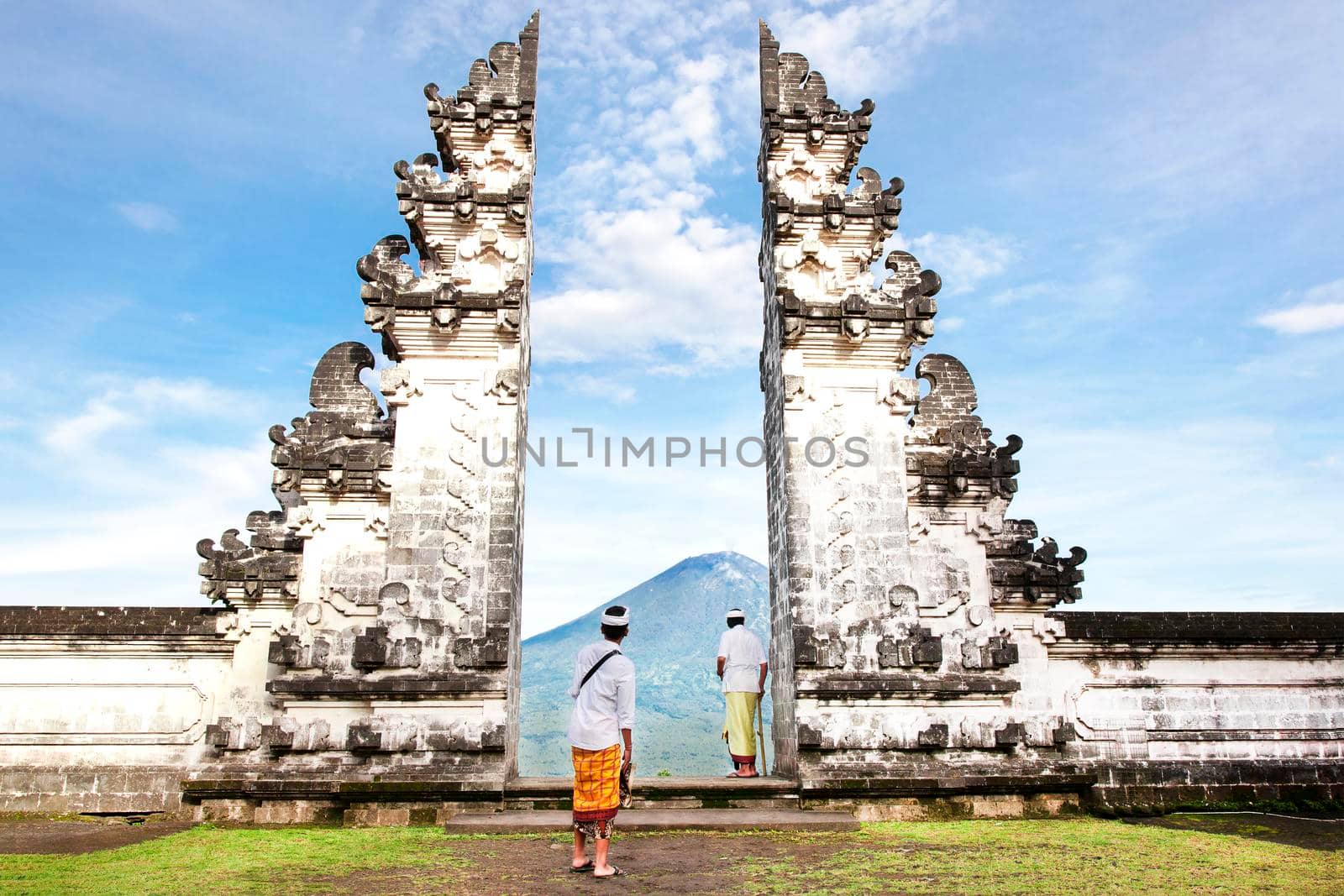 Indonesia - Bali - tourist standing betwen Lempuyang gate by Jyliana