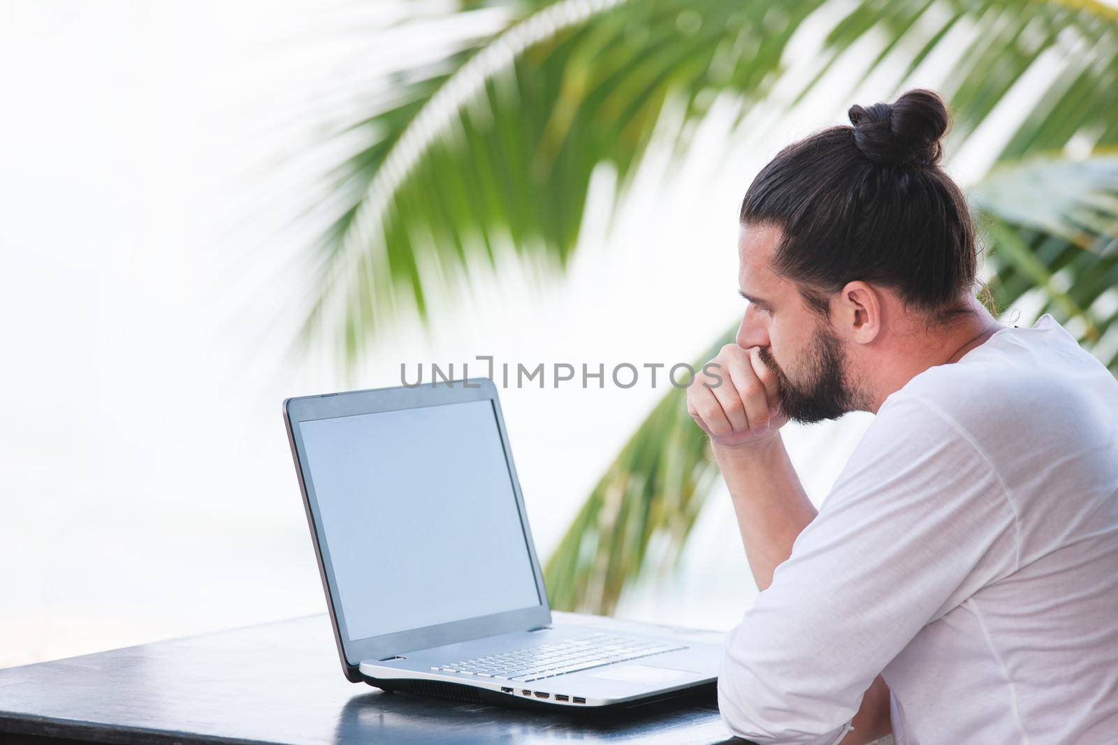 Man relaxing on the beach with laptop, freelancer workplace, dream job by Jyliana