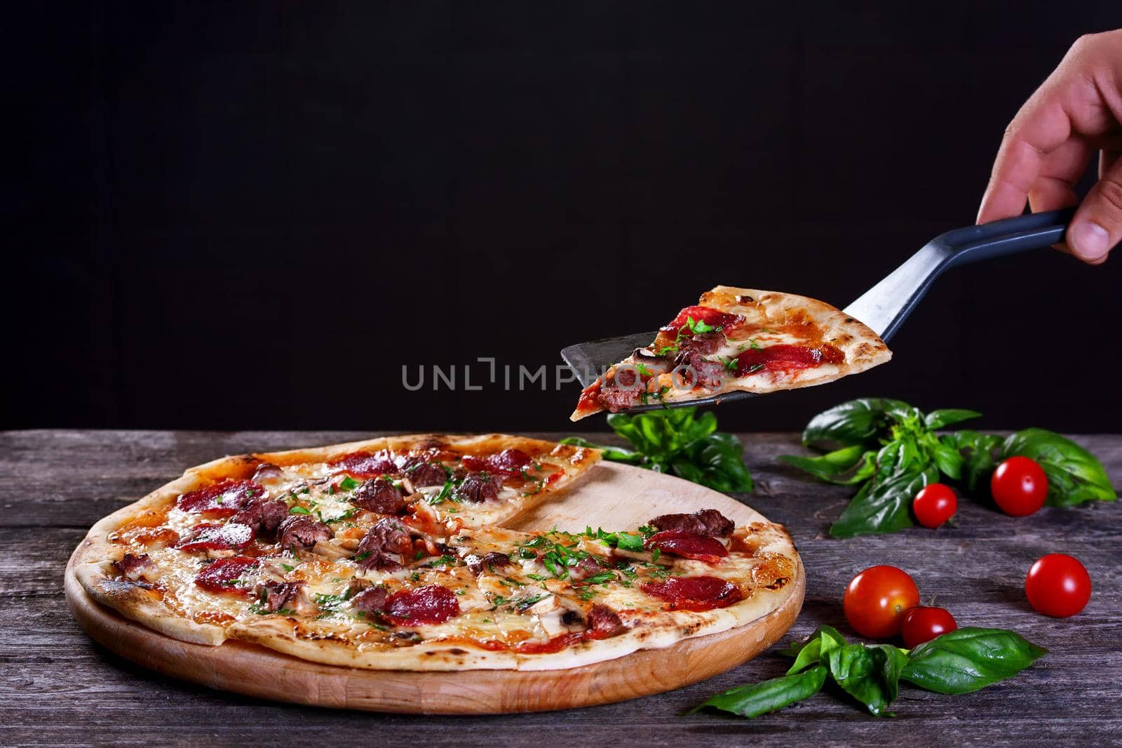 Pepperoni Pizza with salami, mushrooms , meat , beef, cheese and green onions on the wooden background. Top view.