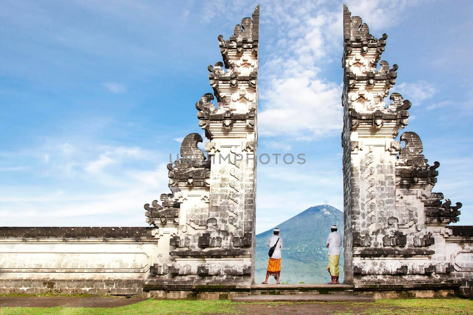 balinese people standing betwen Lempuyang gate. Bali