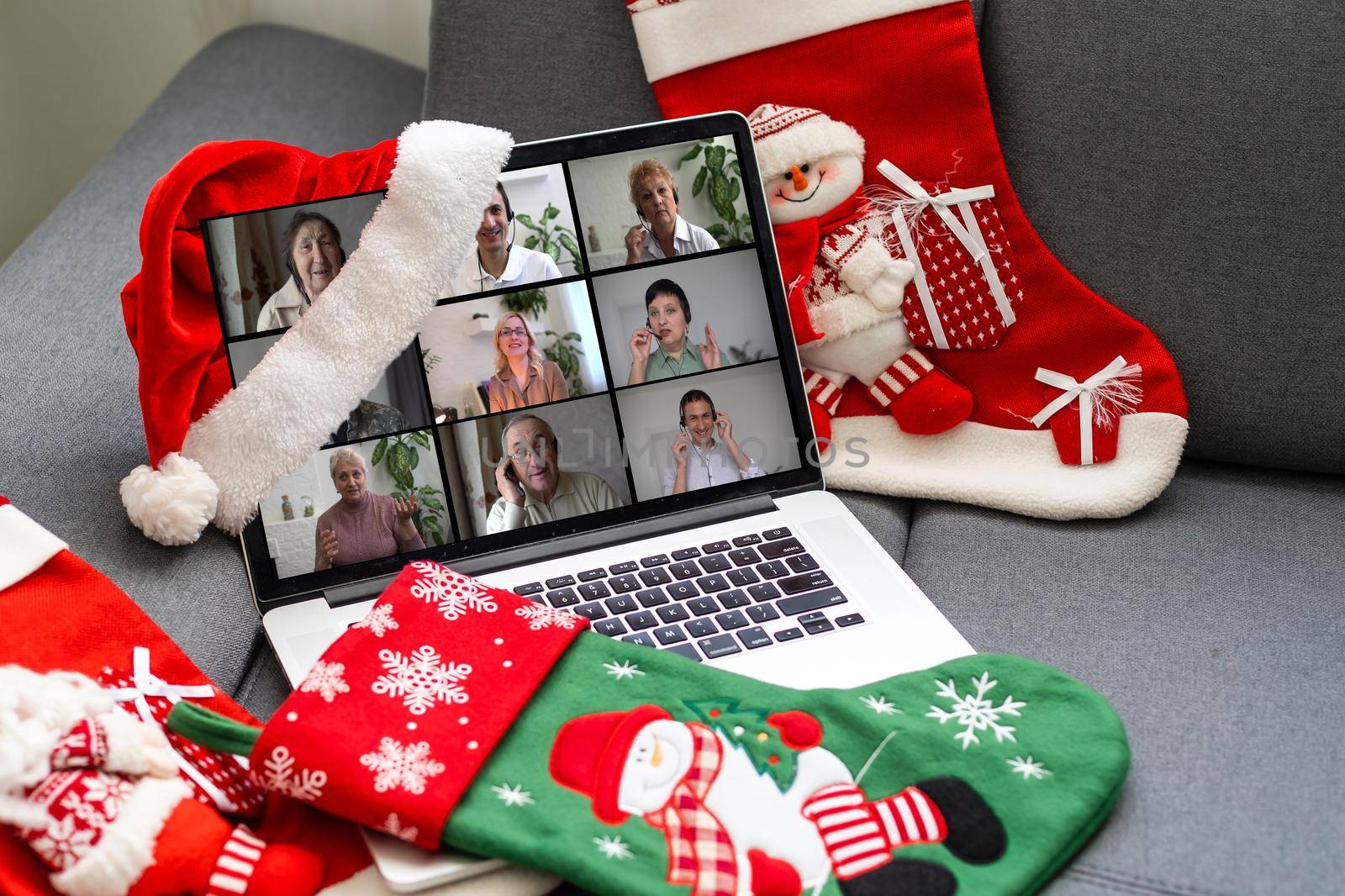 Virtual Christmas meeting team teleworking. Family video call remote conference Computer webcam screen view. party online by Andelov13