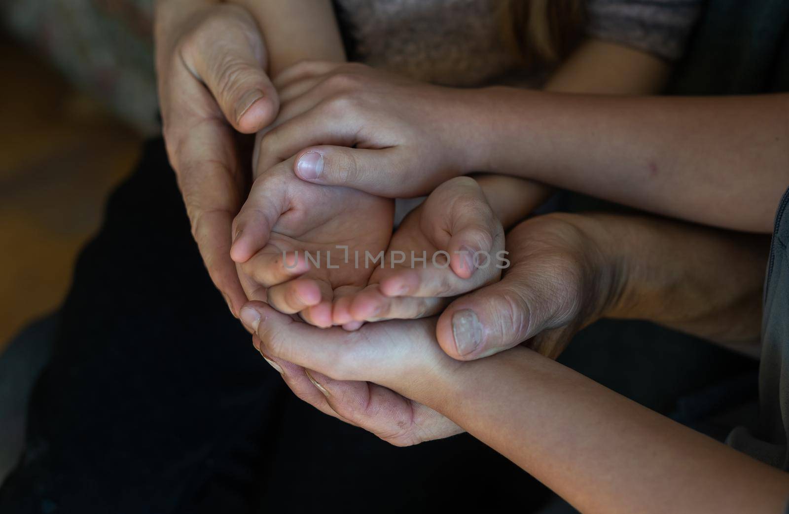 hands of grandfather and granddaughter with prayer by Andelov13