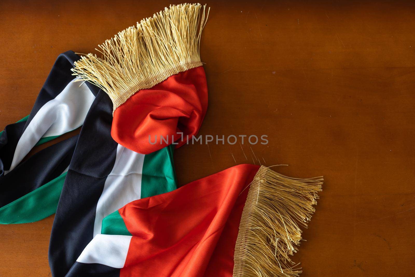 waving fabric texture of the flag with color of united arab emirates, uae real texture flag. by Andelov13