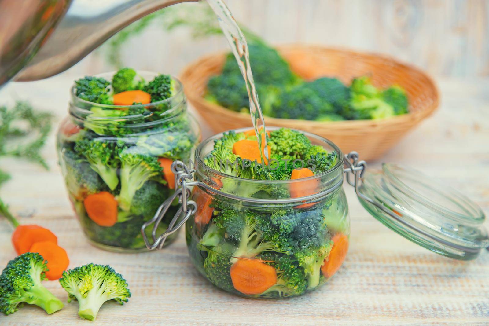 Preservation of broccoli with carrots in jars. Selective focus. nature.