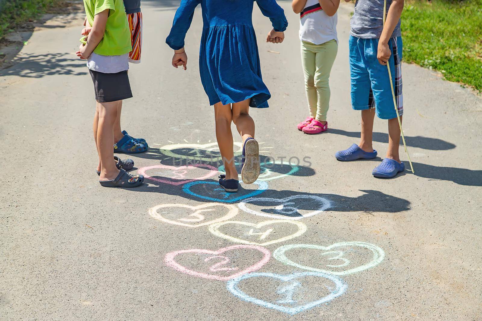 Children's hopscotch game on the pavement. selective focus. by yanadjana