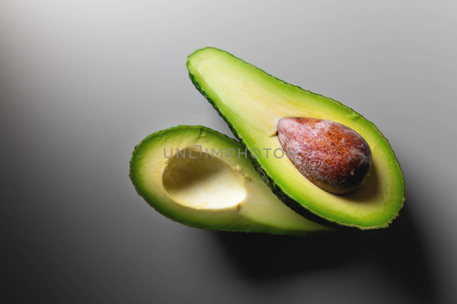 Avocado. Organic avocados on a white table. Healthy vegan food concept. Diet. Dieting.