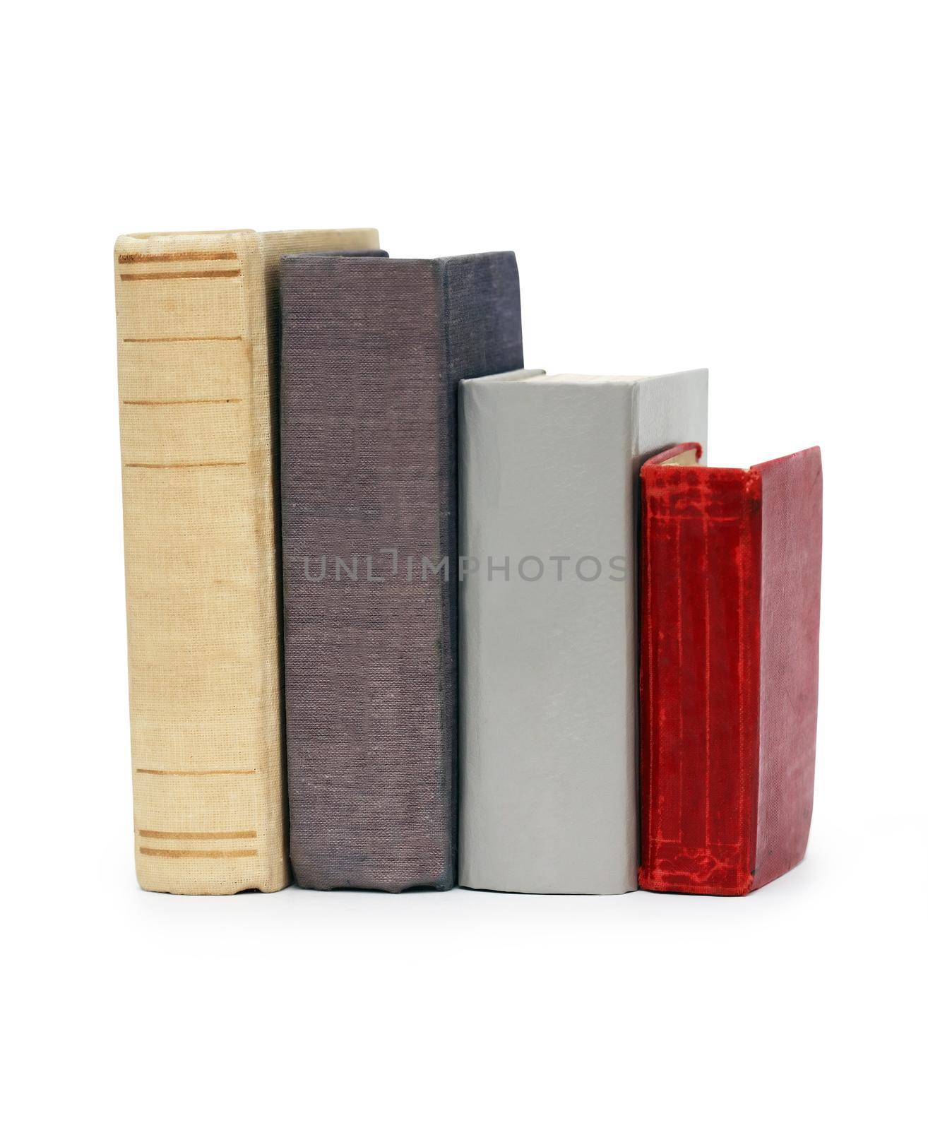 Few old books in a row isolated on white background with clipping path