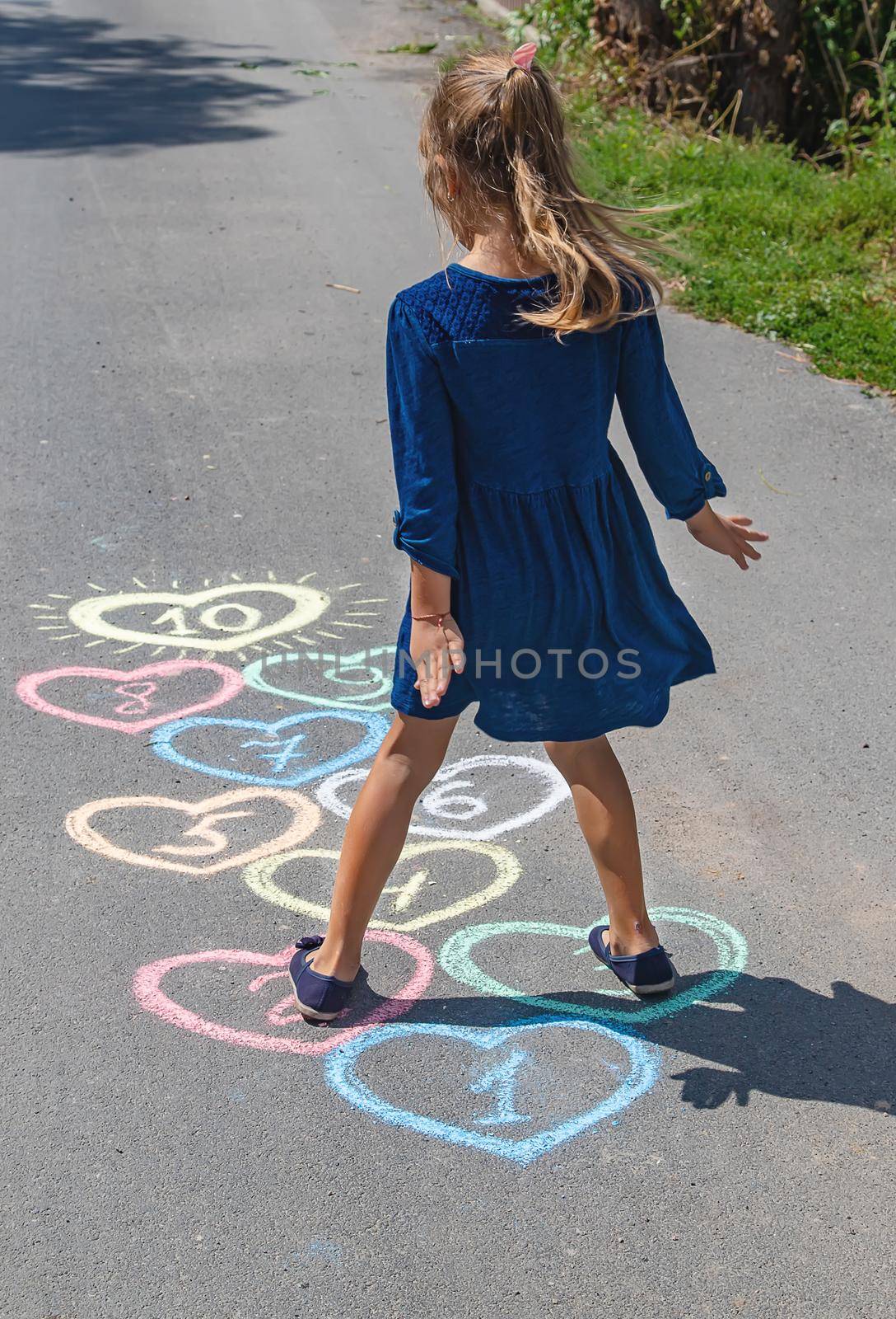 Children's hopscotch game on the pavement. selective focus. by yanadjana