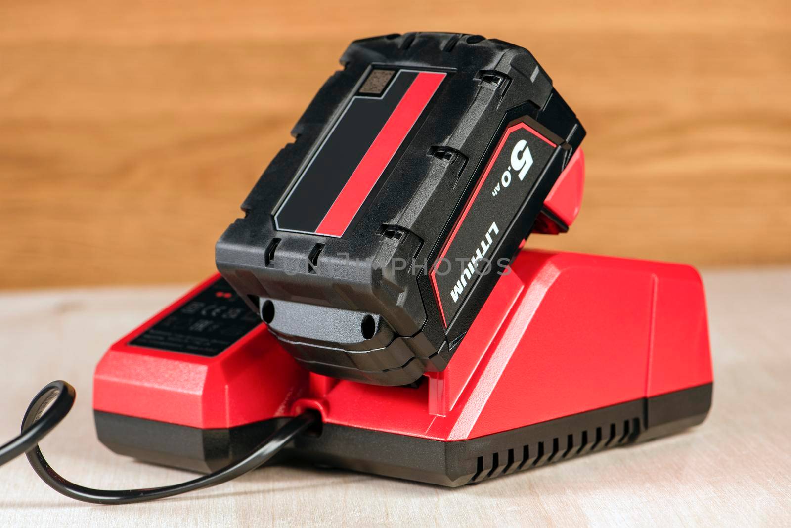 The process of charging a lithium battery from a cordless construction tool. The battery from the screwdriver is charged in the charger by SERSOL