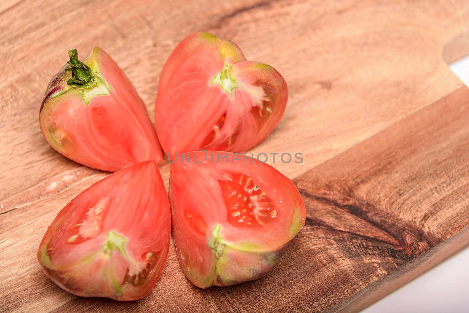 Fresh tomatoes in a plate on a dark background. Harvesting tomatoes. Top view