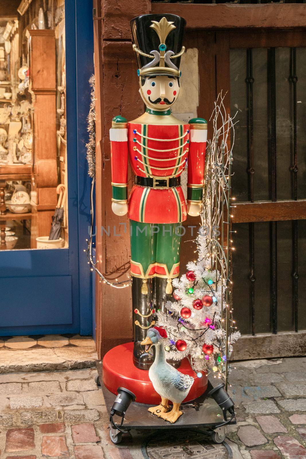 The Nutcracker statue near decorated stores