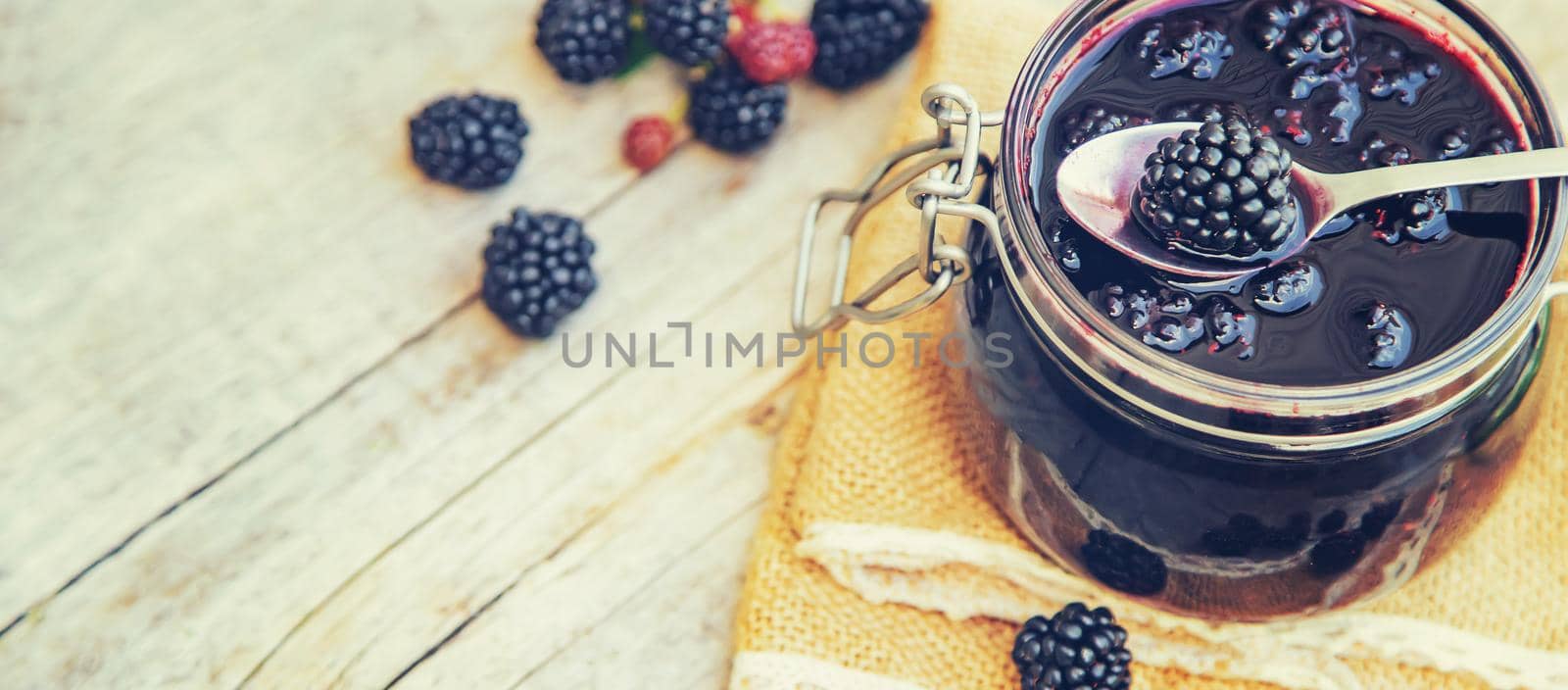 Blackberry jam in a jar. Selective focus. nature