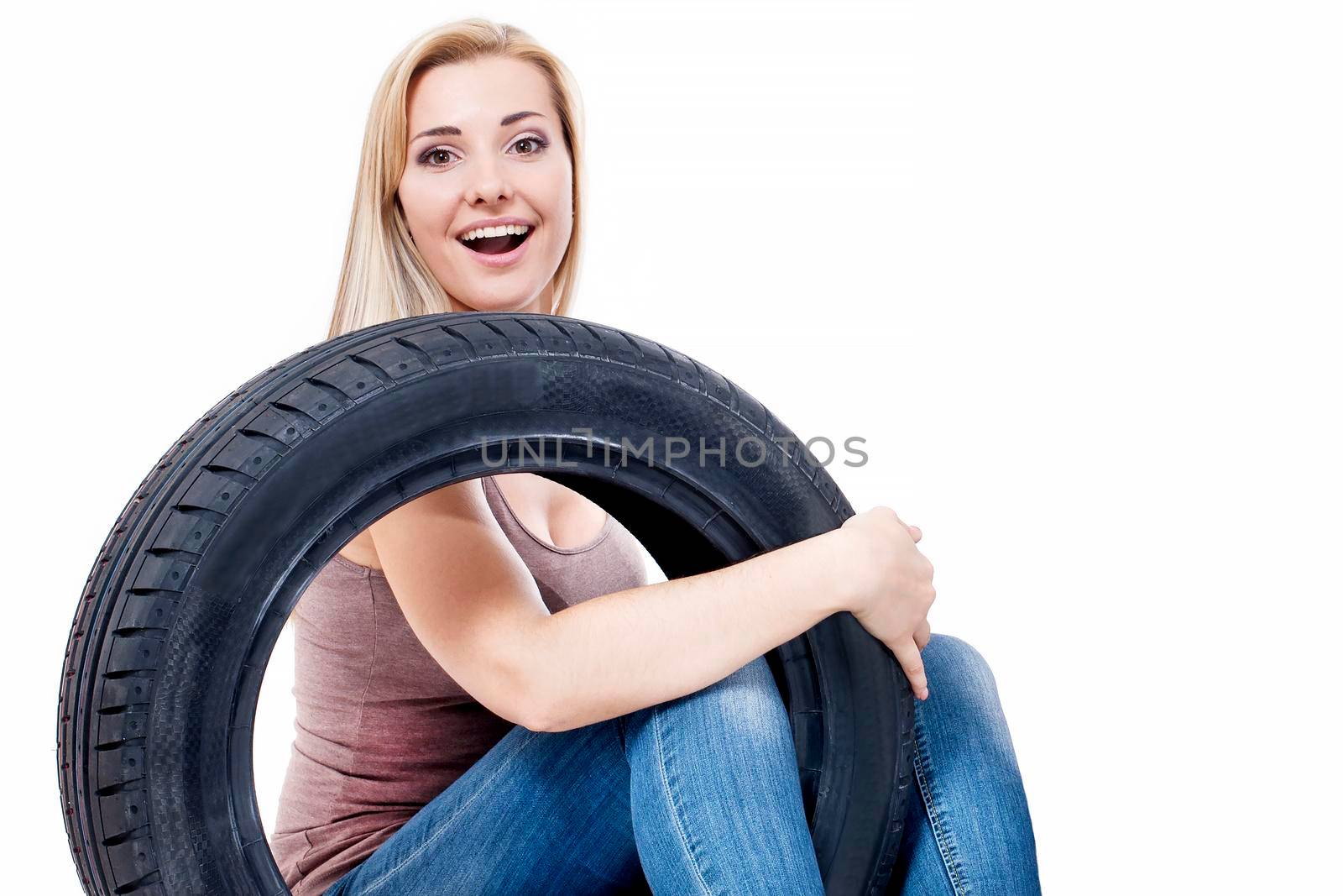 Woman with car wheels, isolated on white.