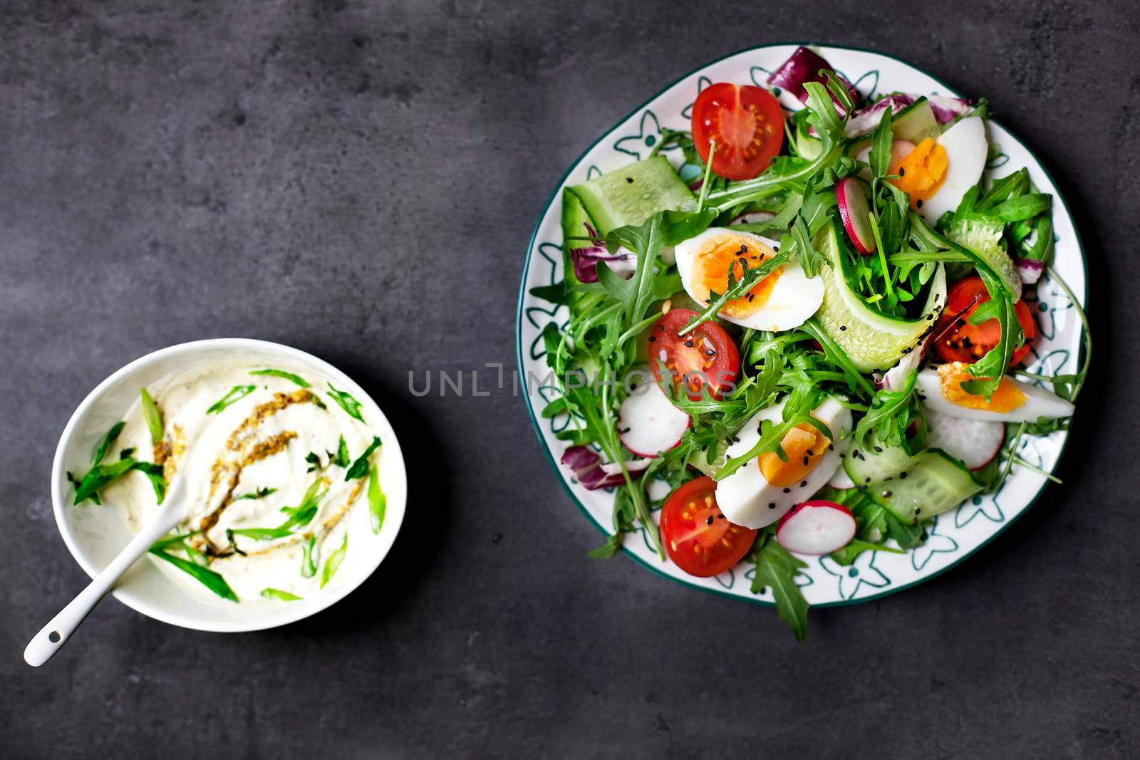 Greek salad on the gray copy space - Stock image
