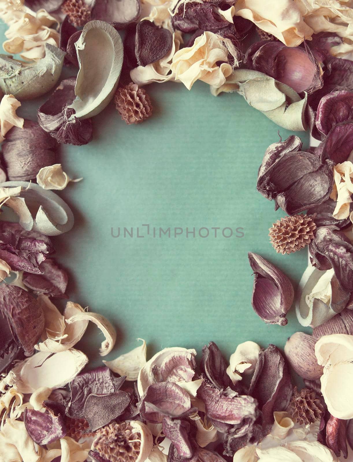 Blank photo frame and dried flowers with vintage filter color by Jyliana