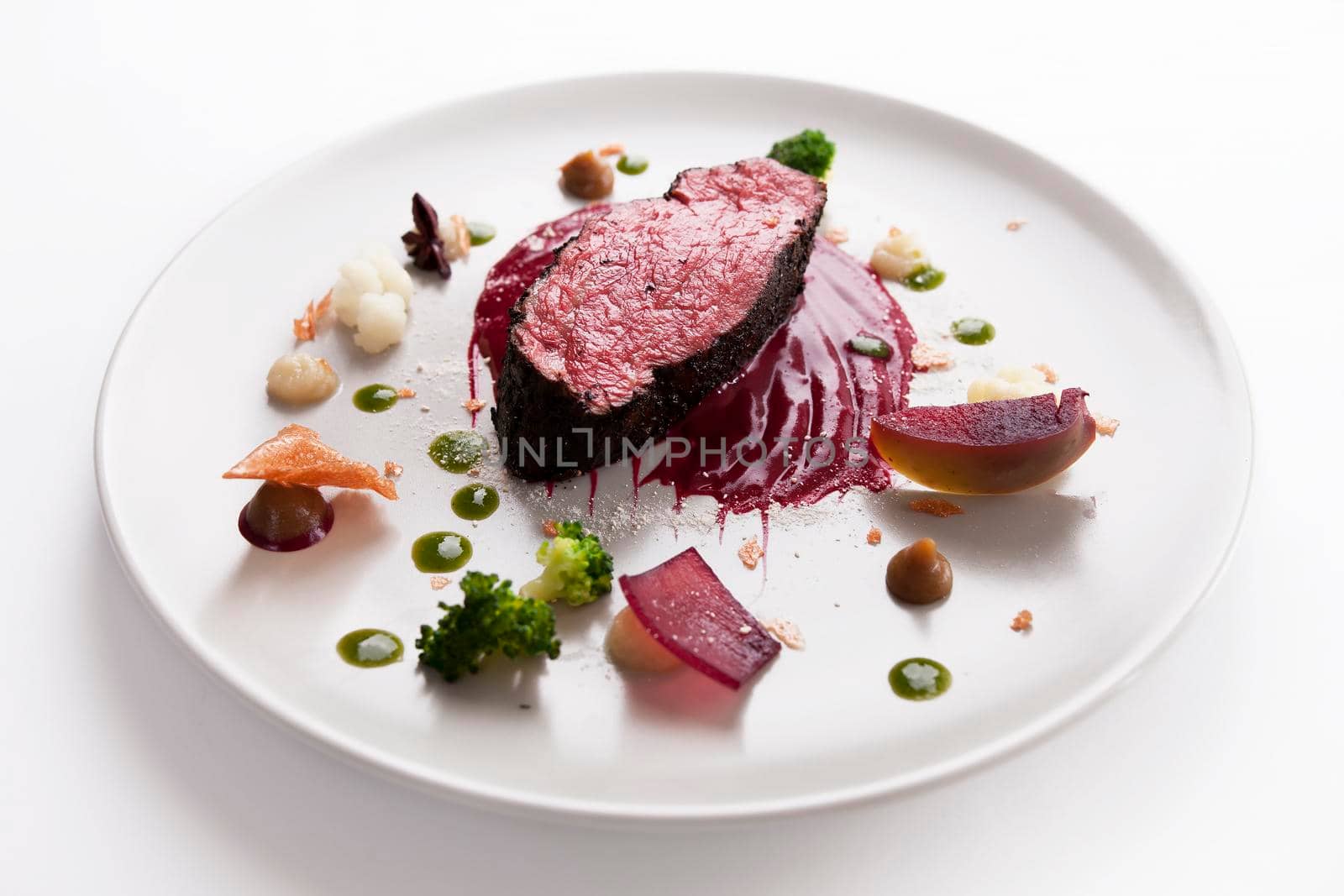 Delicious modern veal fillet served with sauce. Molecular cuisine with steak.