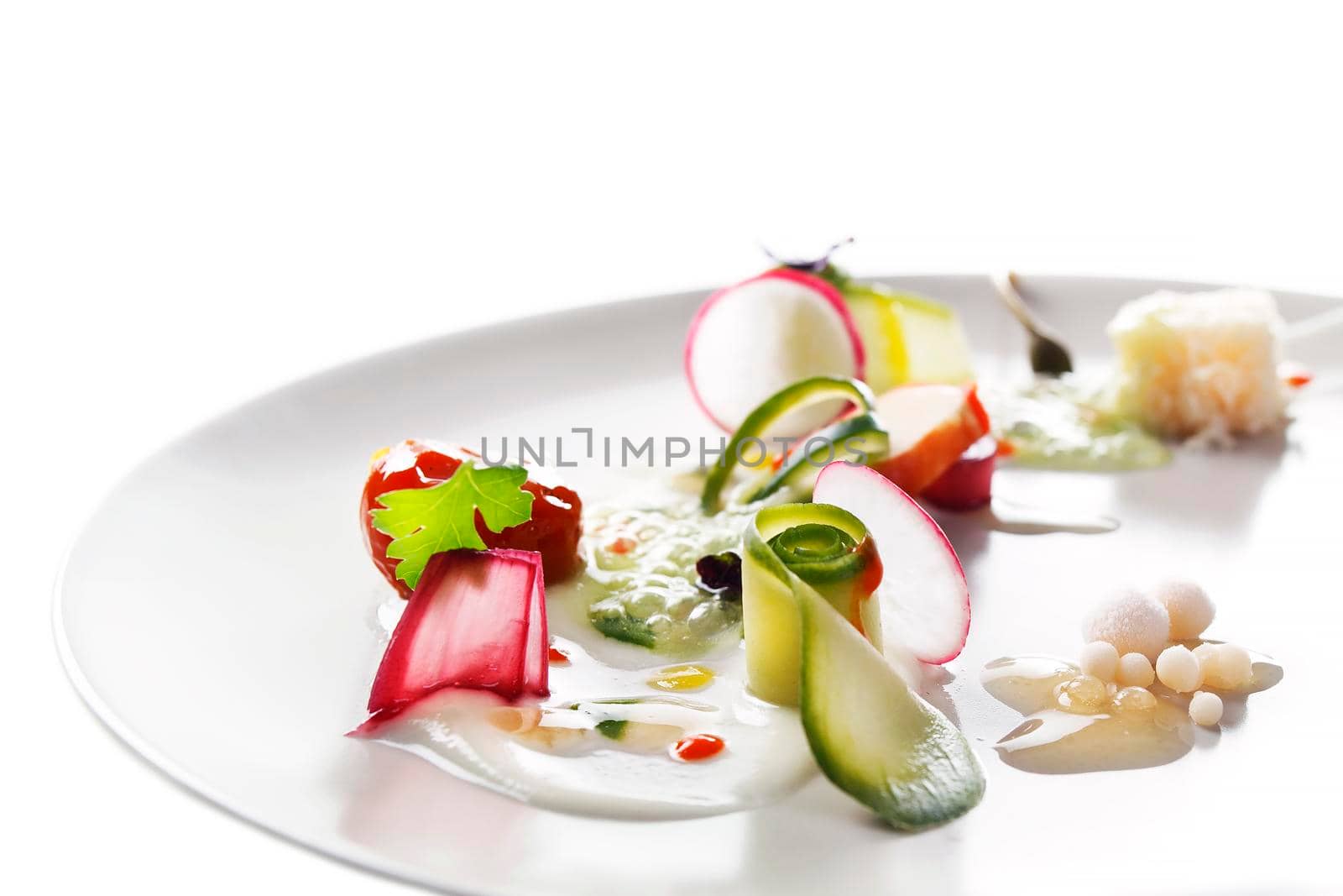 Molecular modern cuisine vegetable salad. Stock image. Isolated on white.