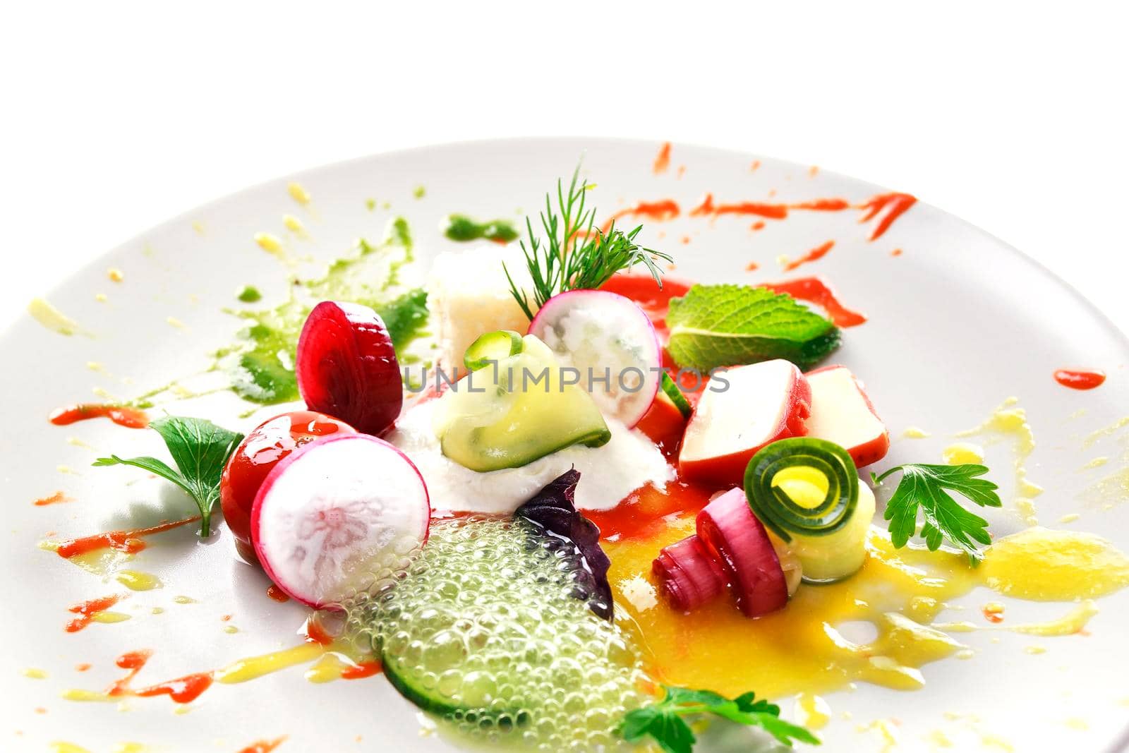 Molecular modern cuisine vegetable salad. Stock image. Isolated on white.