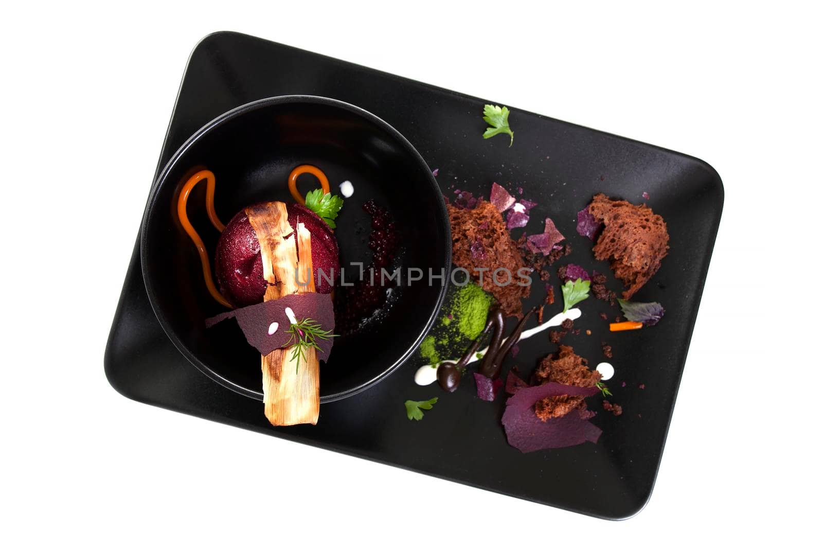 Molecular Cuisine. Delicious modern soup with beetroot. Isolated on white. Stock image.