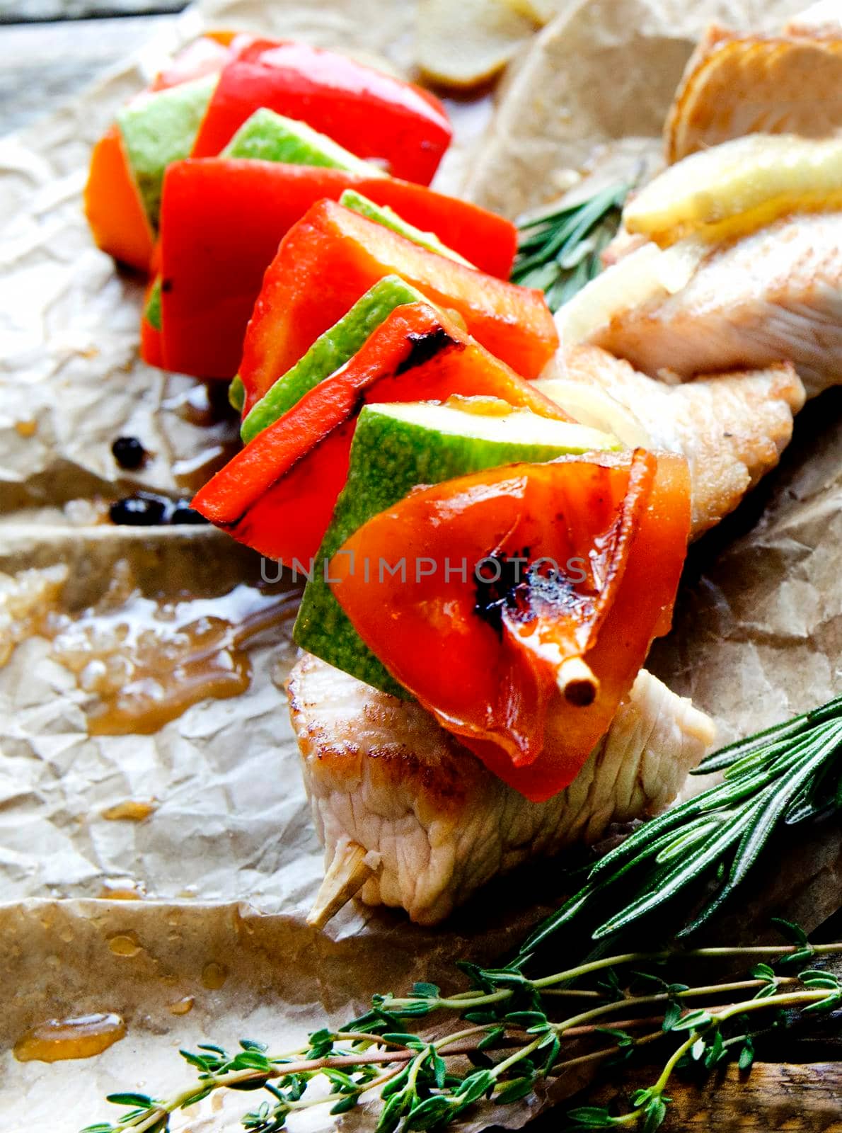 Two fried chicken skewers of grilled meat BBQ Kebab and vegetables - Stock image