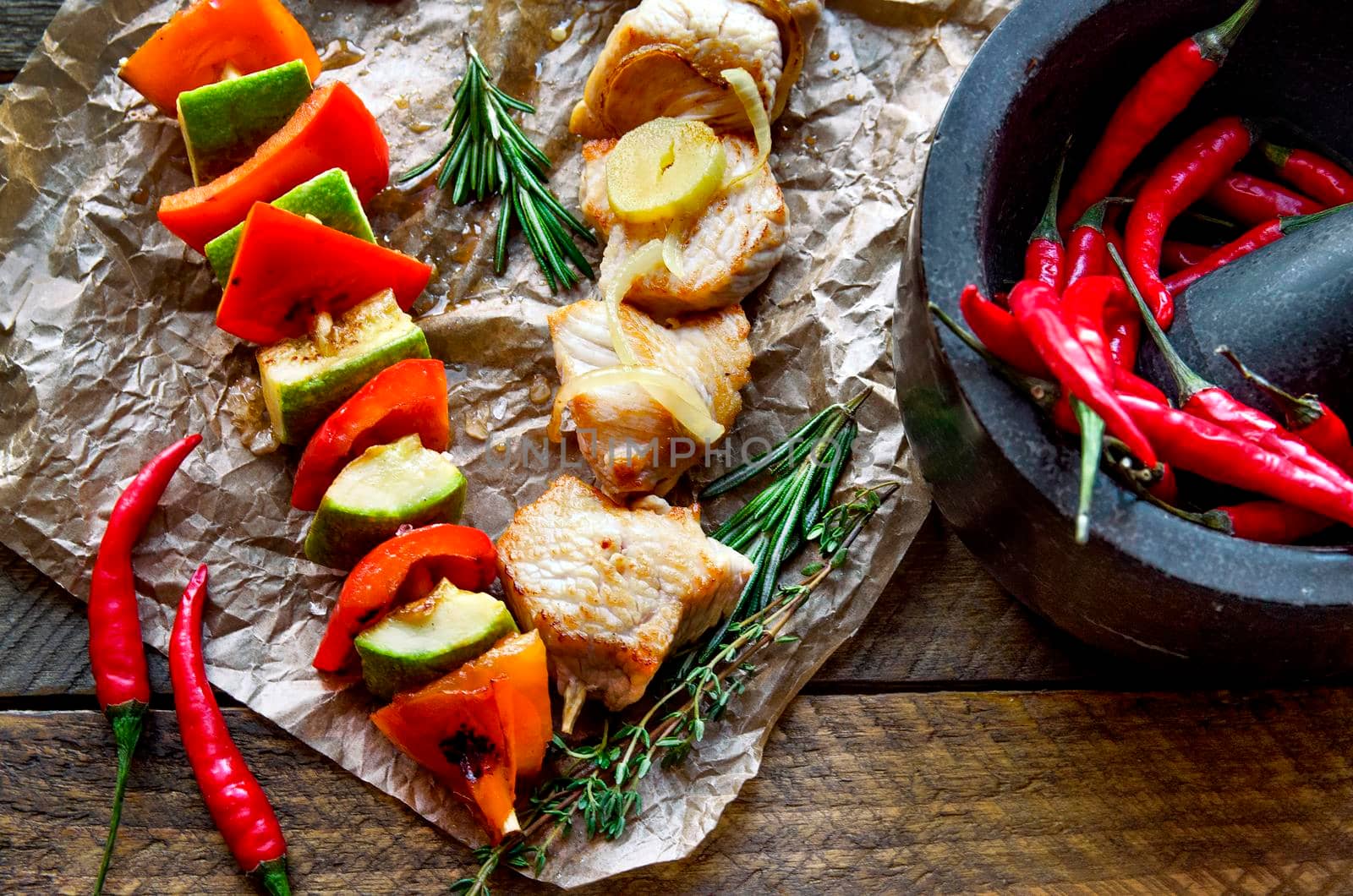 Two fried chicken skewers of grilled meat BBQ Kebab and vegetables - Stock image