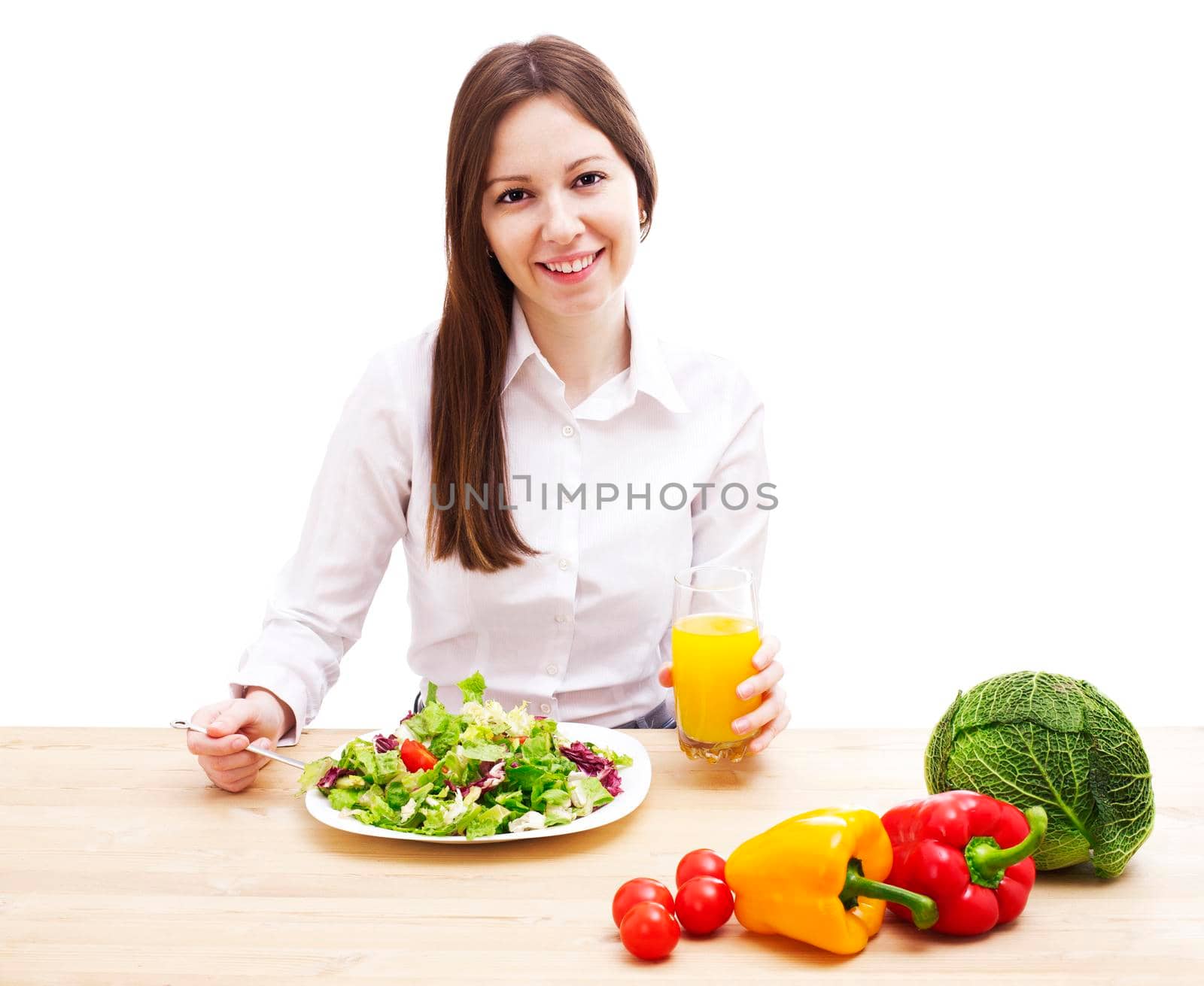 Woman with plate of salad, orange juice and vegetables, isolated on white.