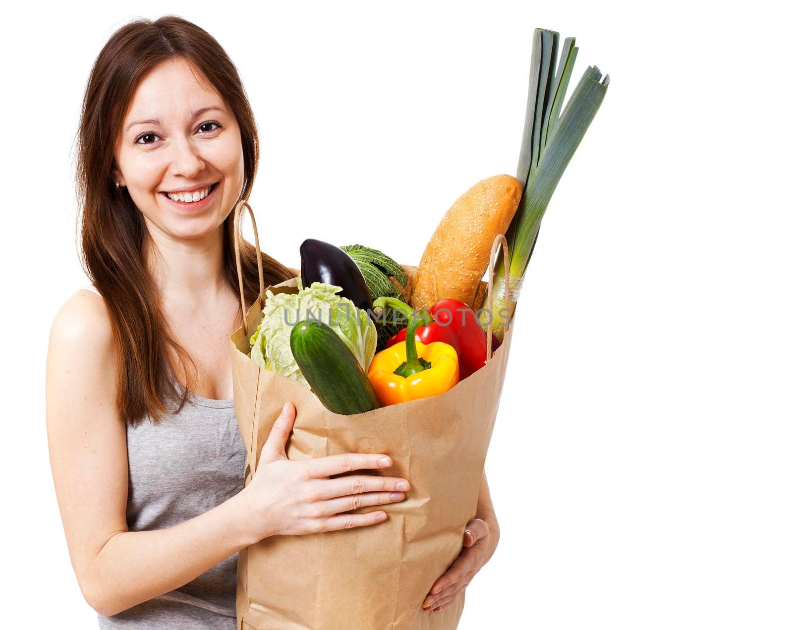 Happy Young Woman Holding Large Bag of Healthly Groceries - Stock Image/ Isolated on white