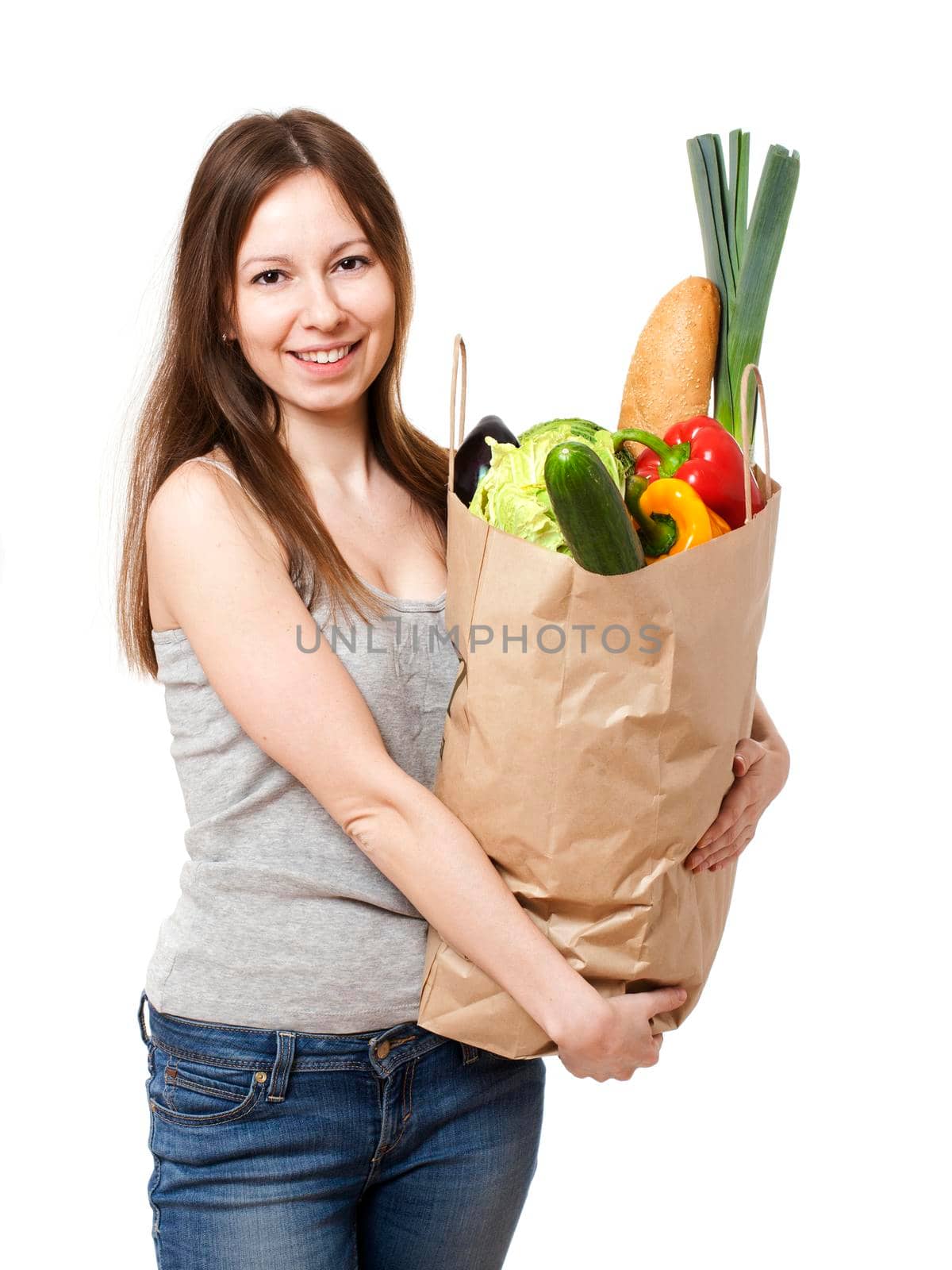 Happy Young Woman Holding Large Bag of Healthly Groceries - Stock Image/ Isolated on white