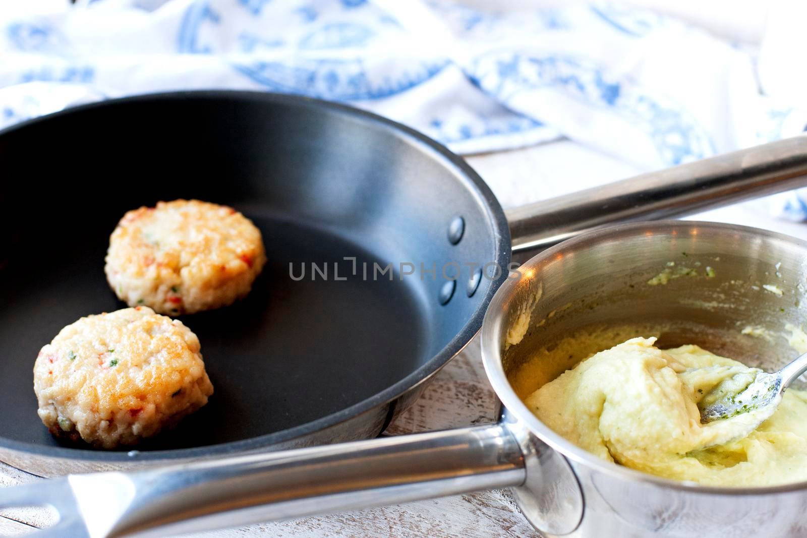 Fish or chicken Cutlet with mashed potatoes on a pan