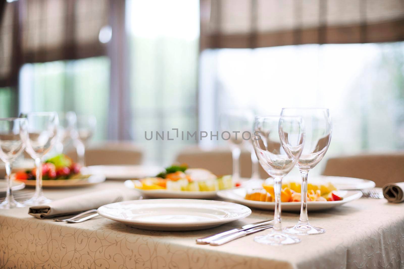 Catering services background with snacks and glasses for wine in restaurant