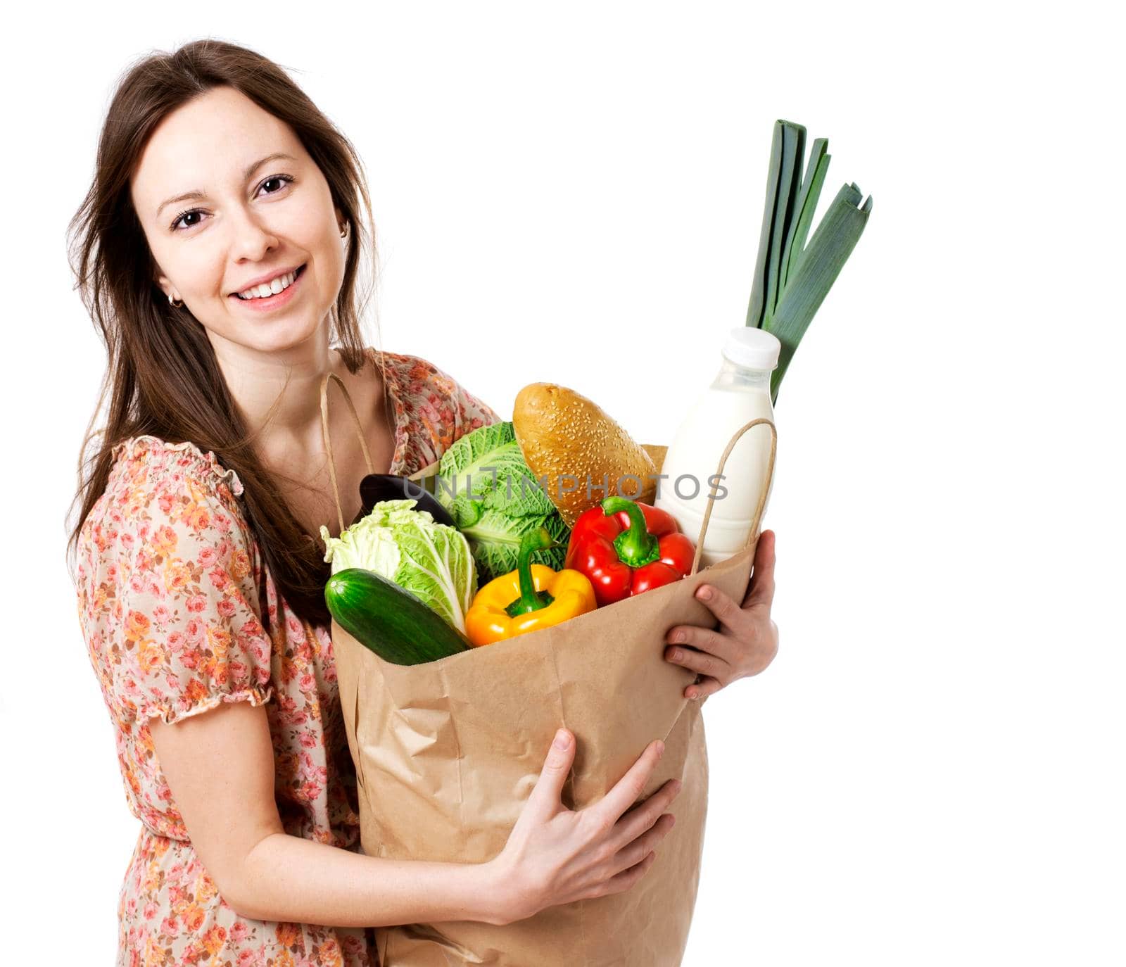Happy Young Woman Holding Large Bag of Healthly Groceries - Stock Image. Isolated on white