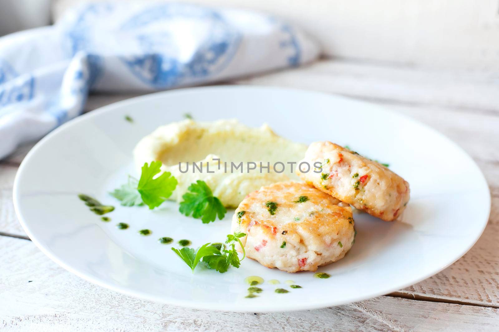 Fish or chicken cutlets with mashed potatoes. Restaurant.