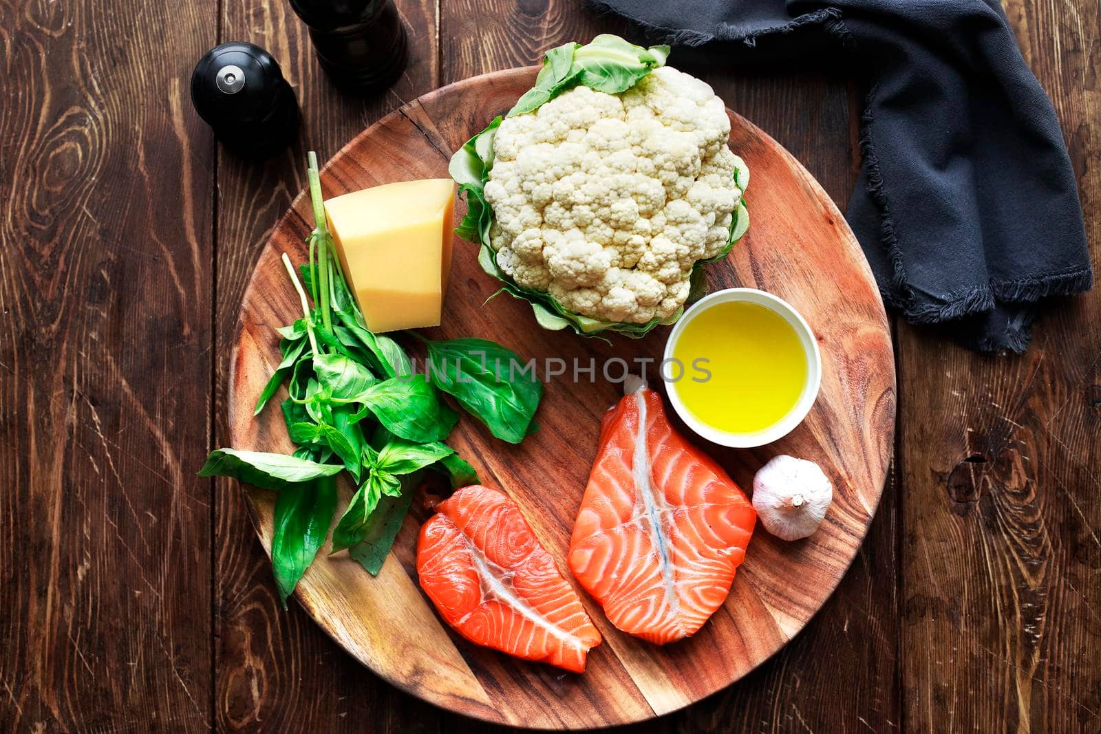 Raw humpback salmon steaks, rustic wooden background, above view. Fillet with fresh ingredients for tasty cooking and frying pan. Top view. Healthy and diet food concept.