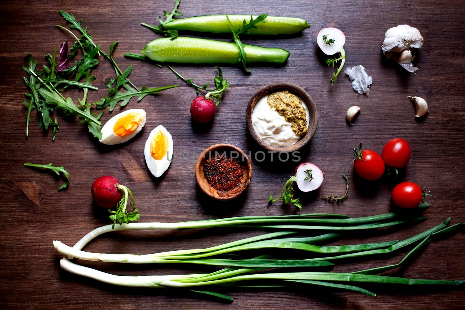 Raw Vegetables over rustic table - Stock image