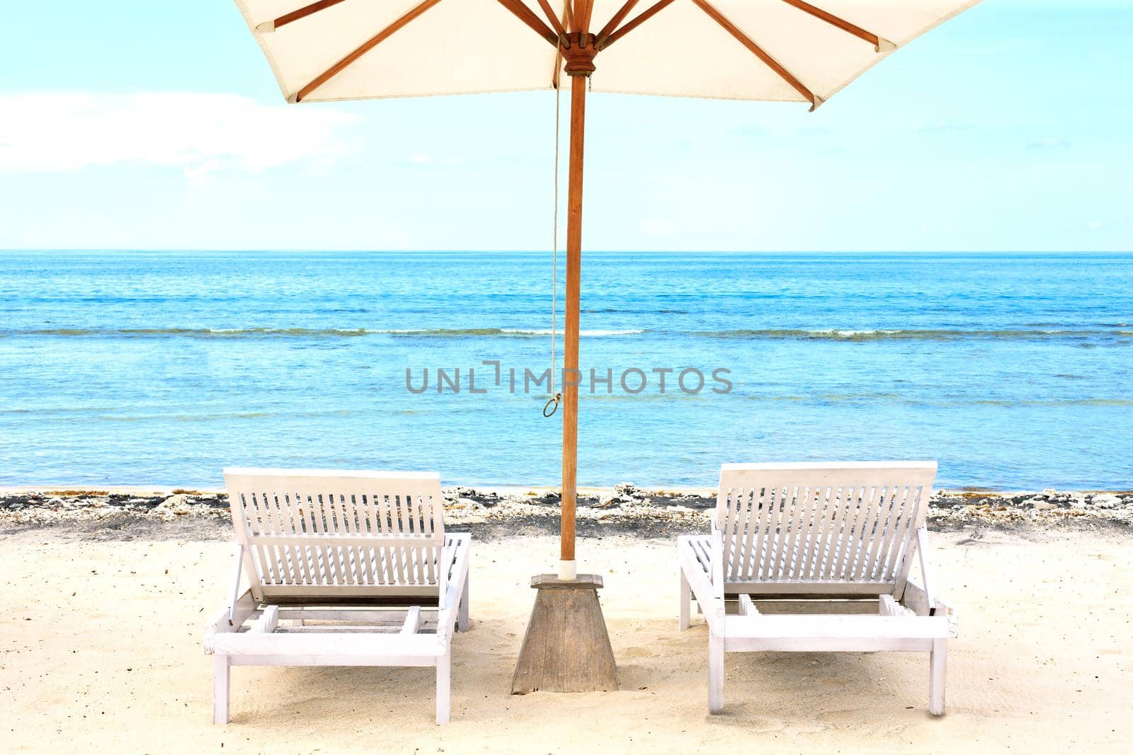 Beach Sun chairs on exotic tropical white sandy beach