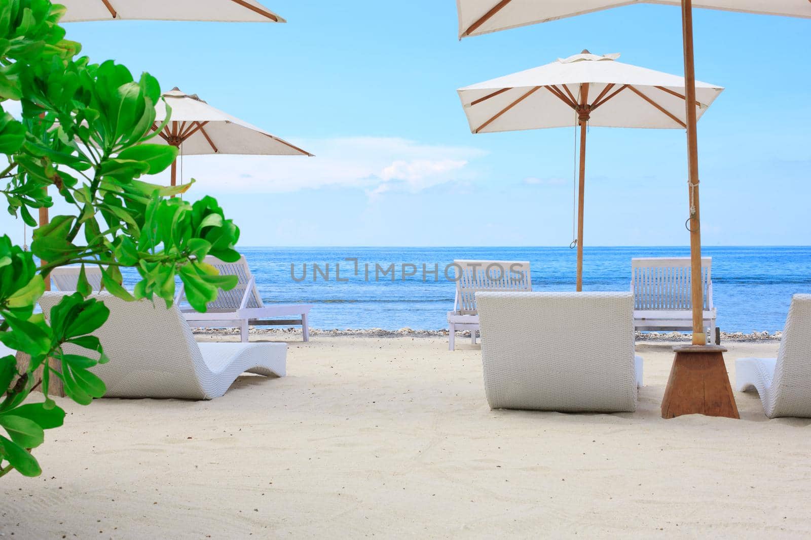 Beach Sun chairs on exotic tropical white sandy beach