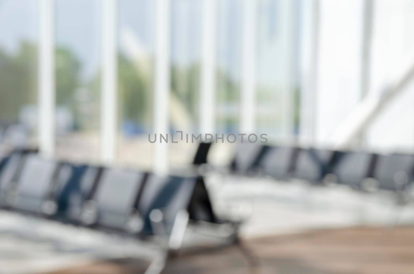 Blurred seat for passenger waiting fight in airport. by Jyliana