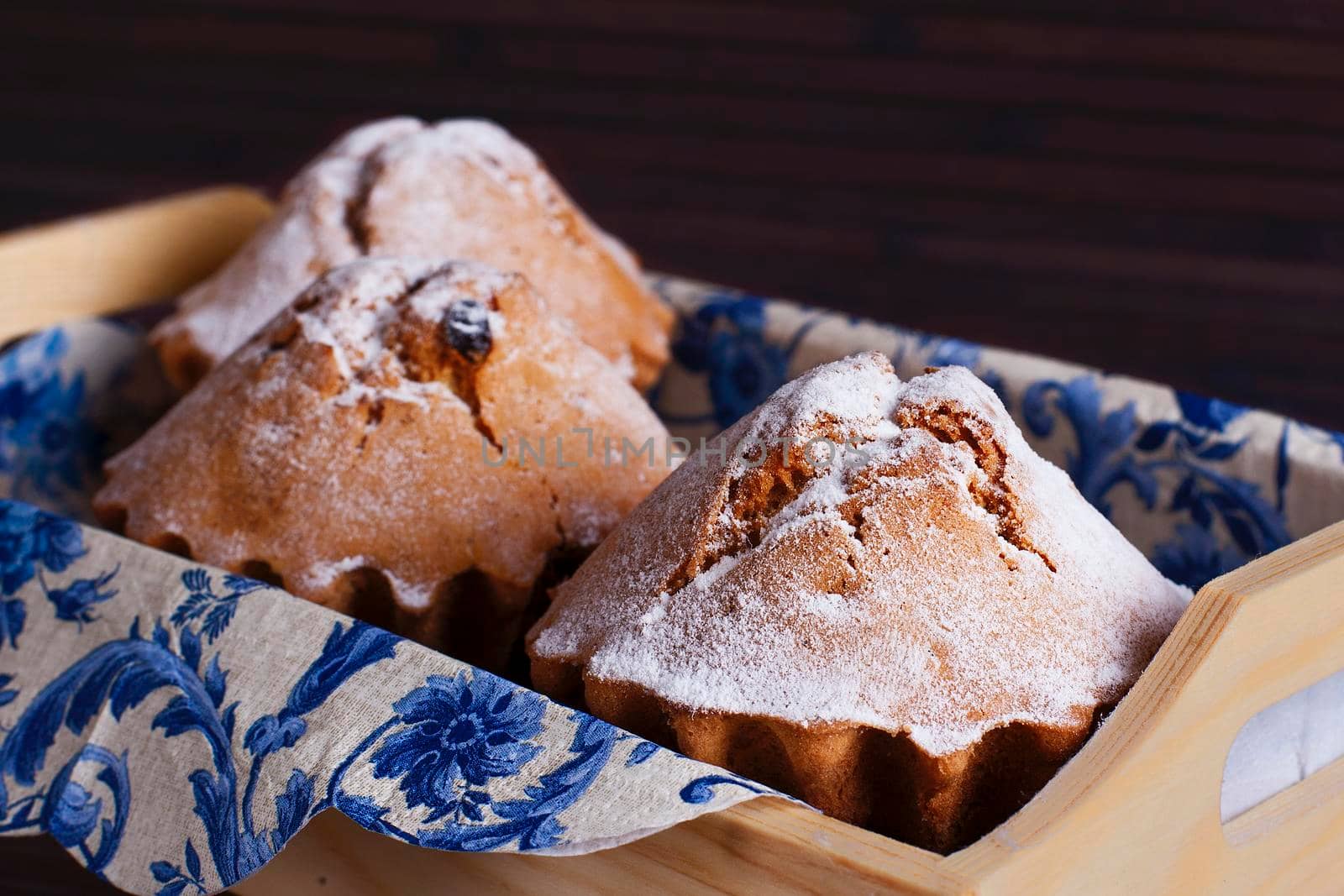 Muffin cakes in wooden tray. Stock image.