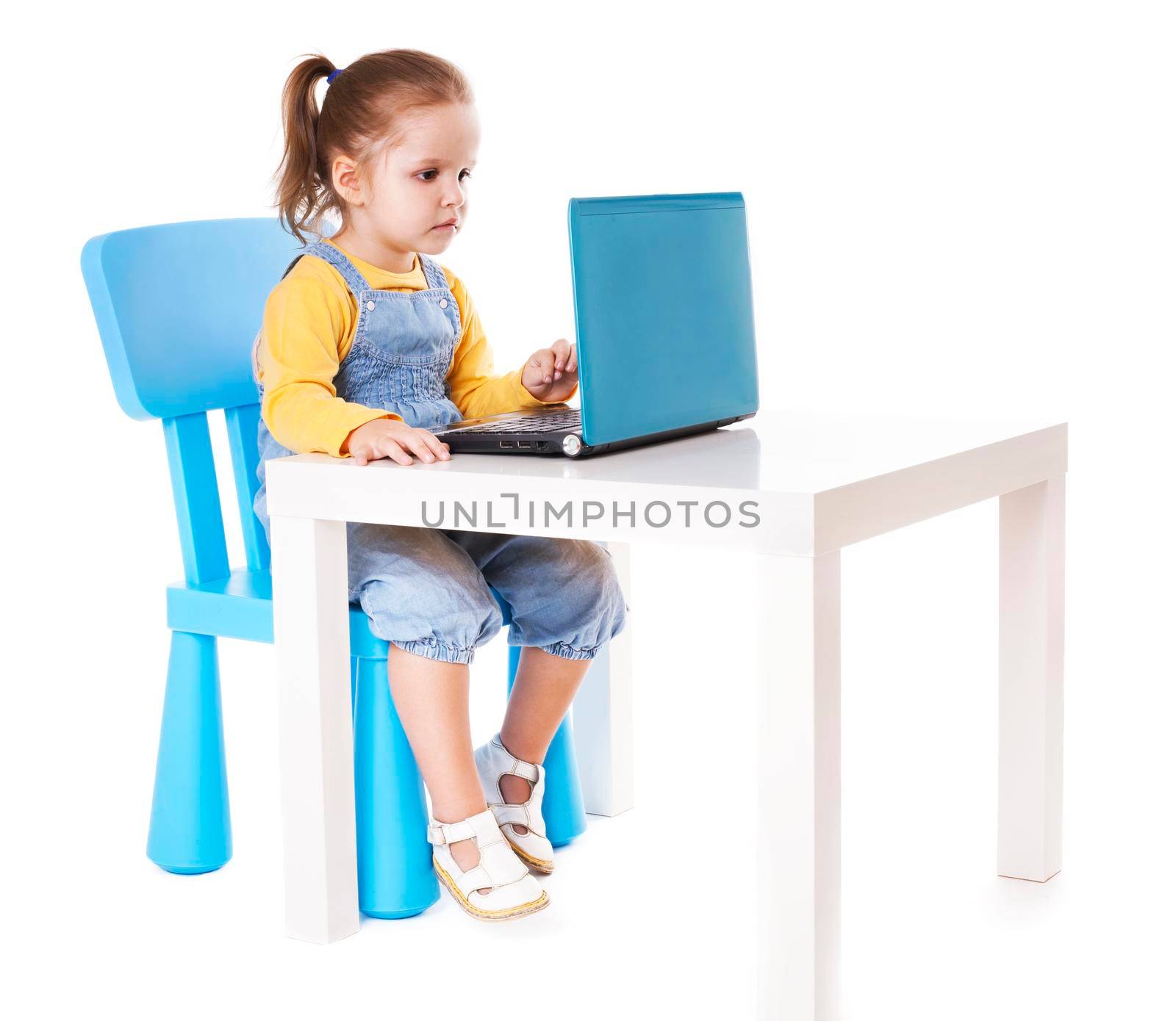 Little Girl Using Laptop - Isolated - Stock Image by Jyliana