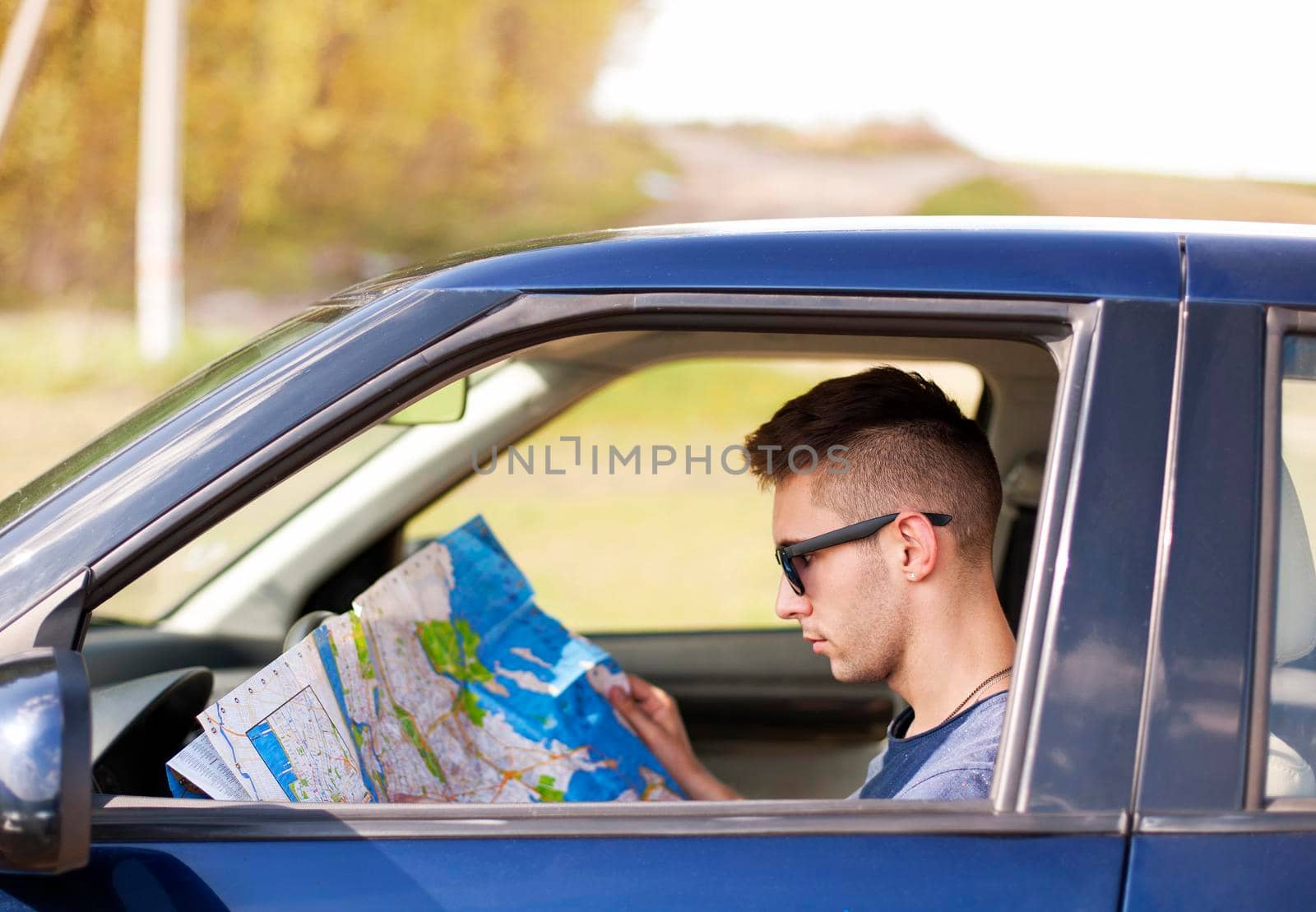 Reading the Map - Stock Image by Jyliana