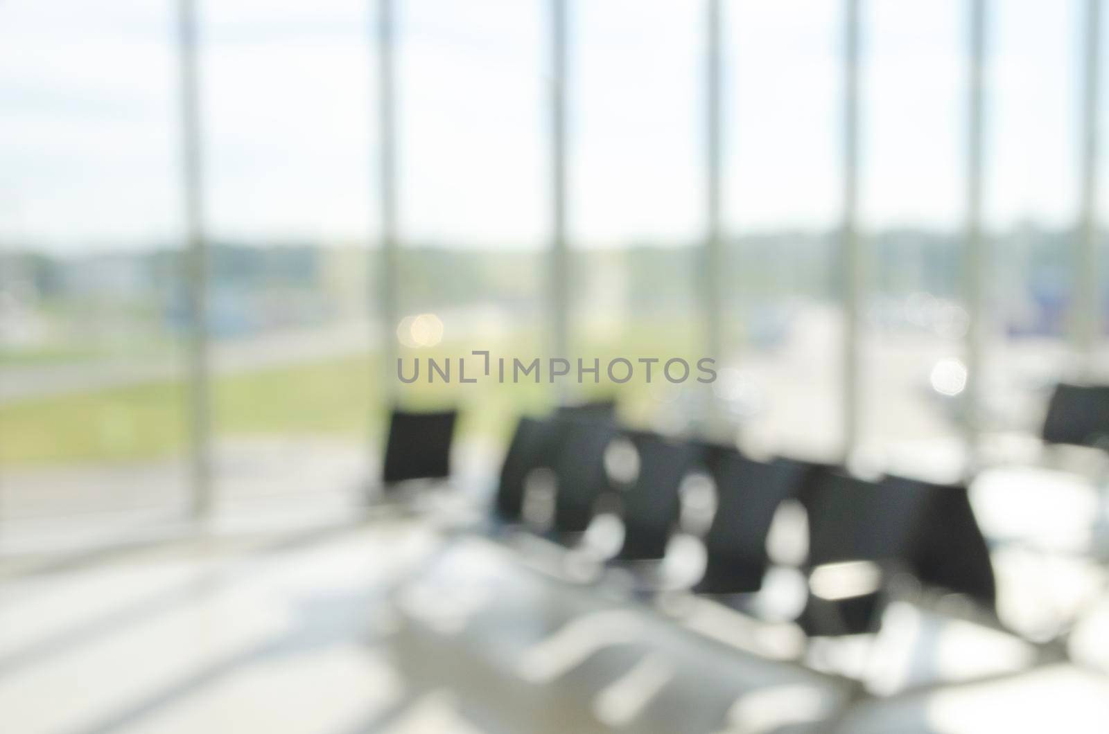 Blurred seat for passenger waiting fight in airport. by Jyliana