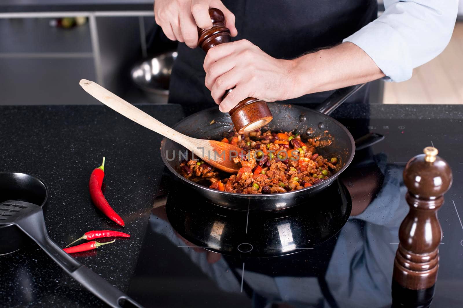 Chef preparing dishes in a frying pan. Cooking. Stock image