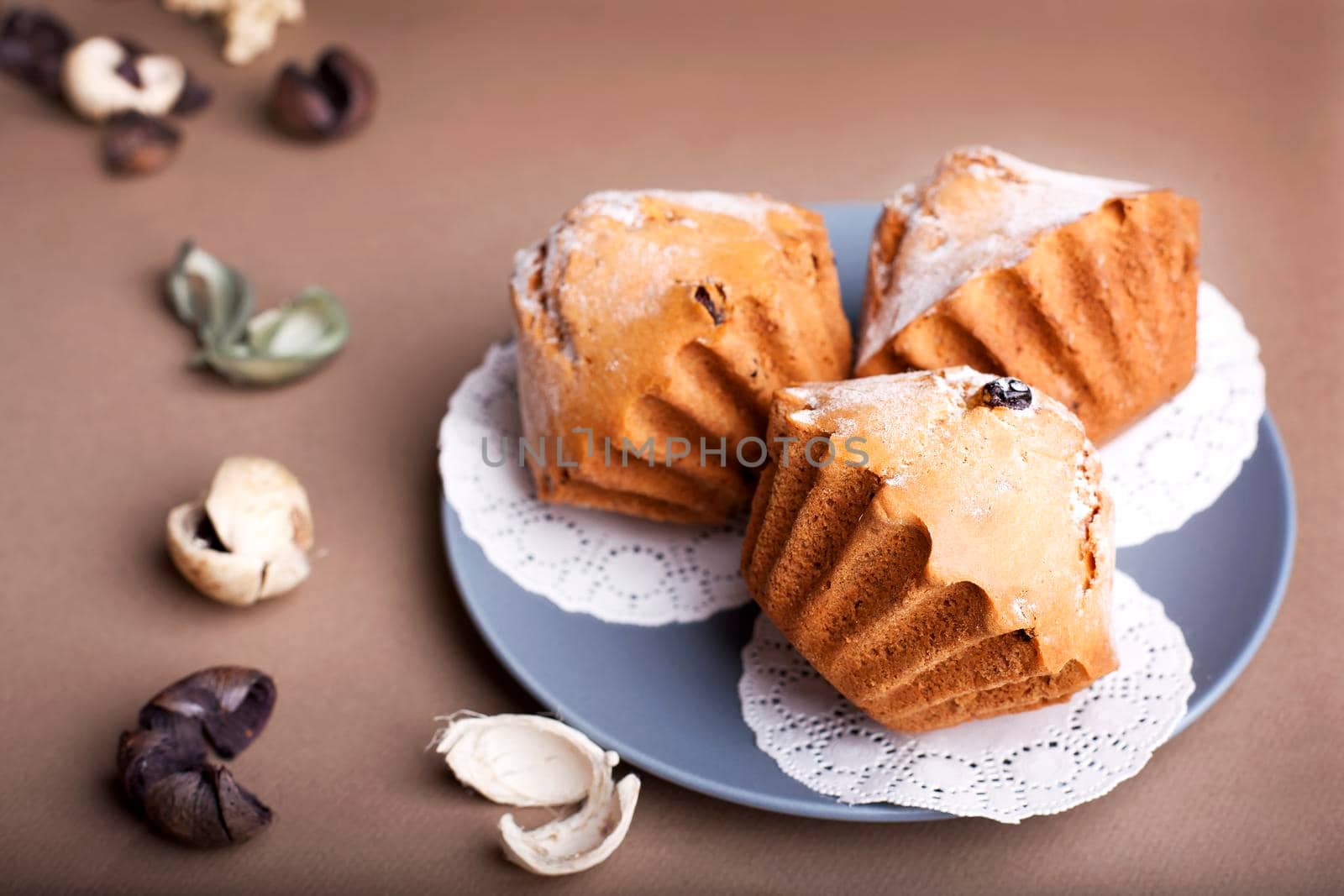 Muffin cakes on a Beige - coffee background. by Jyliana