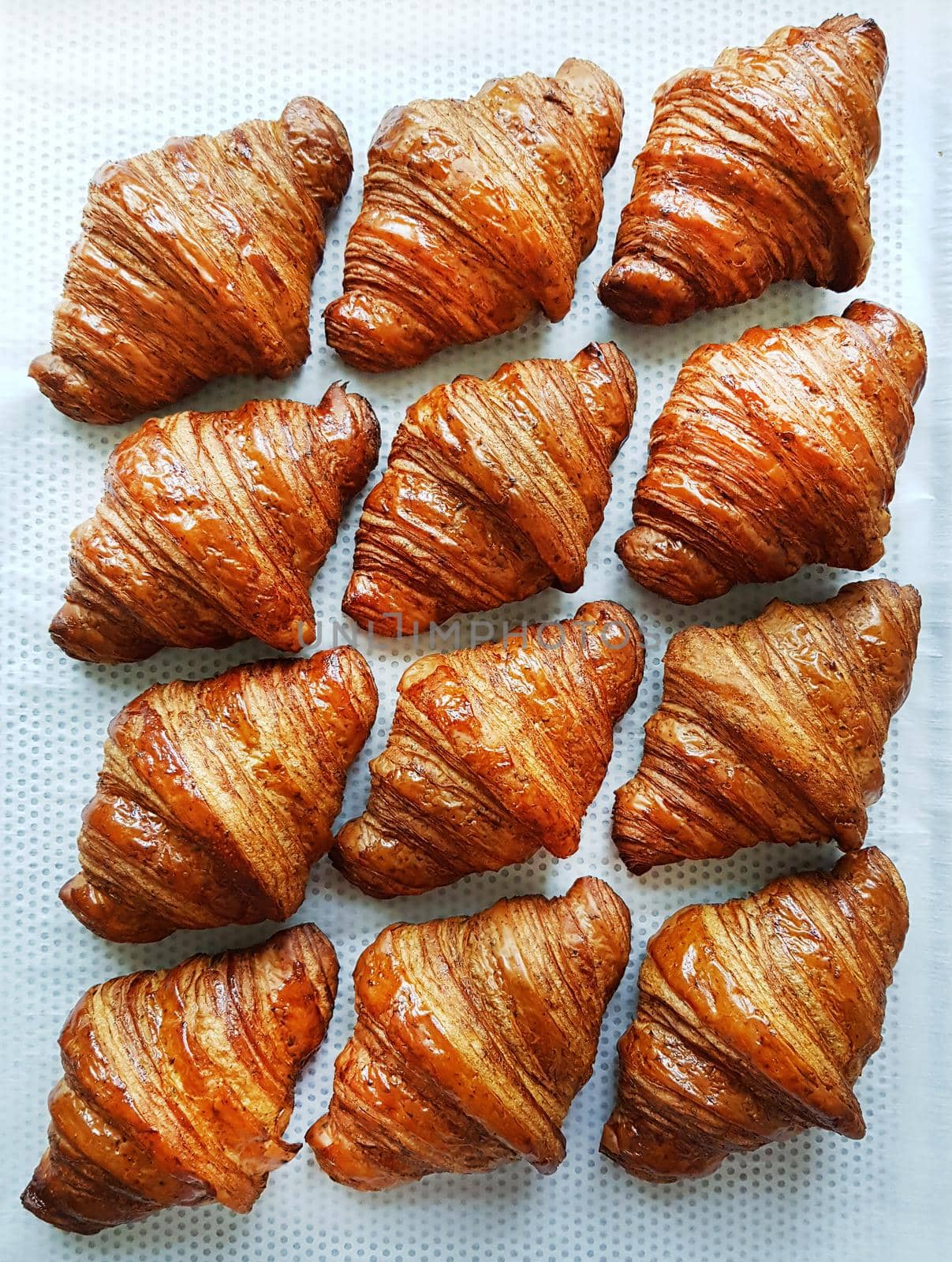 Croissants. Flat lay composition with tasty croissants on patterned background. Flat lay. French bakery concept.