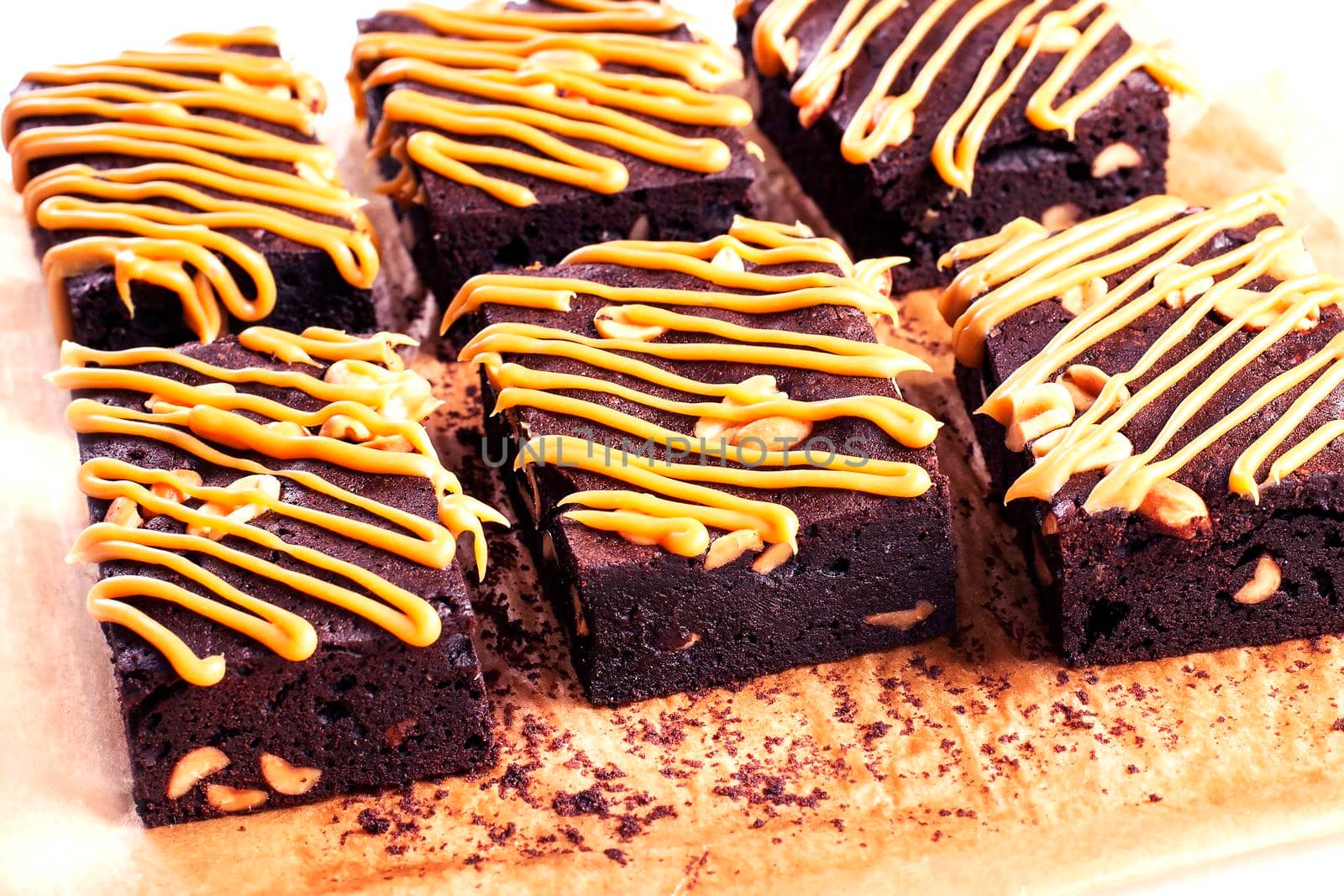 Dark Chocolate Cake with caramel. Pastry: Brownie - Stock image