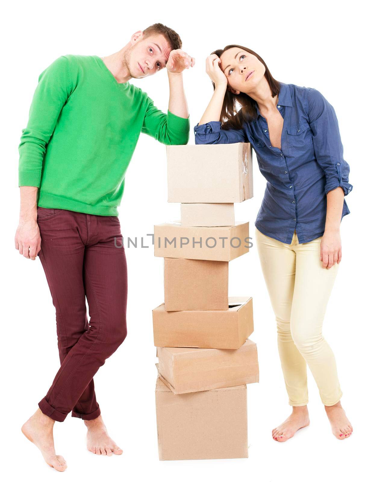 Young Couple With Moving Boxes - Isolated - Stock Image by Jyliana