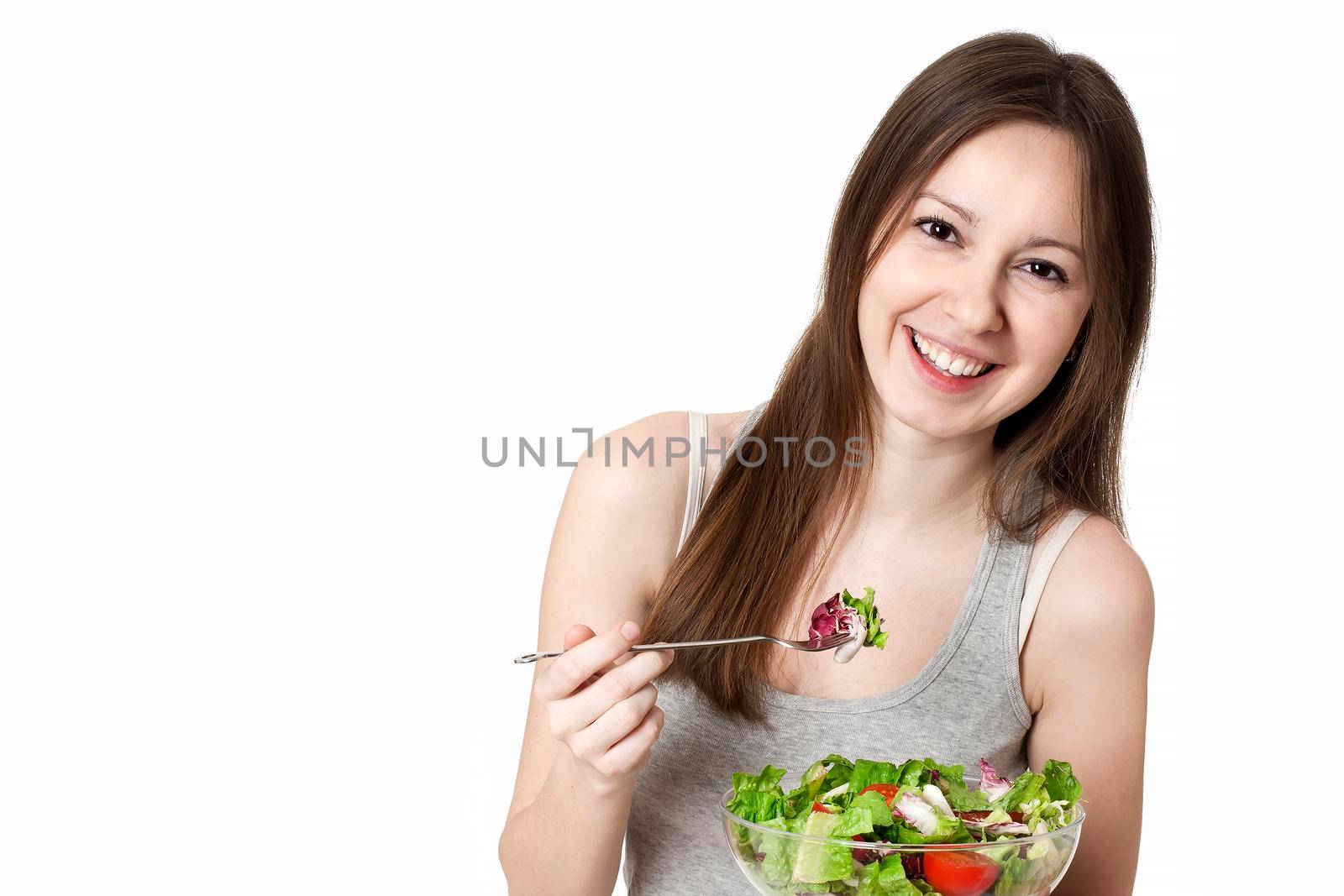 Woman with bowl of salad, isolated on white.
