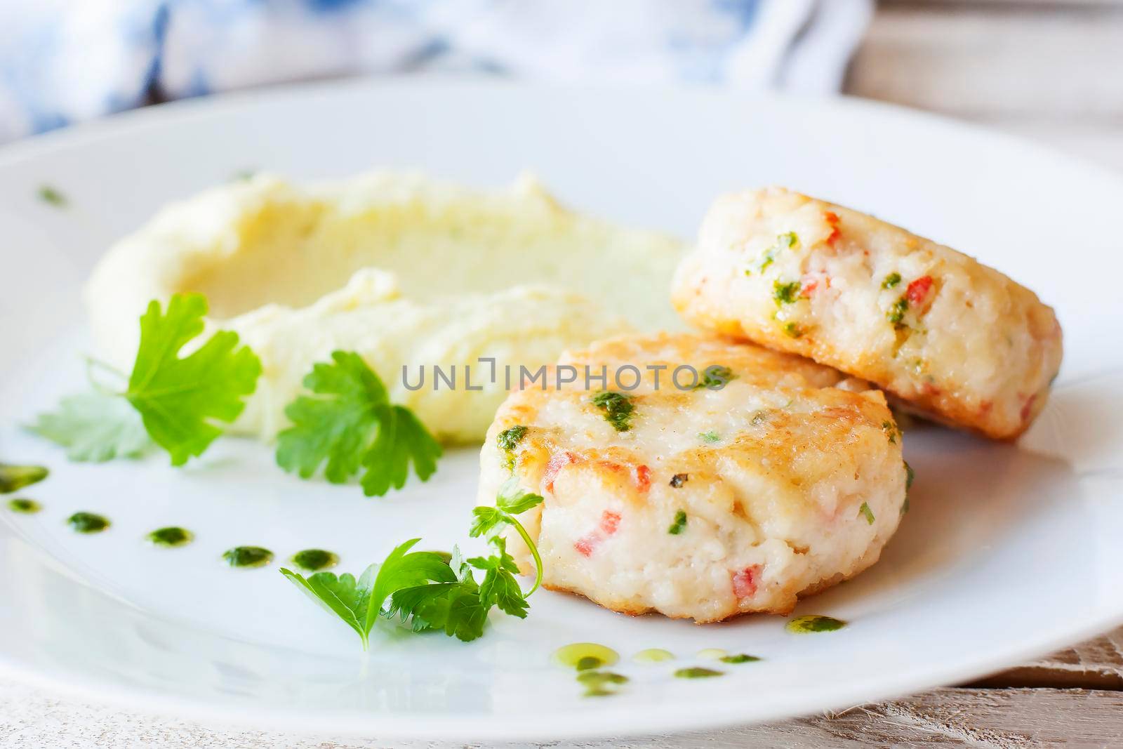 Fish or chicken cutlets with mashed potatoes. Restaurant.