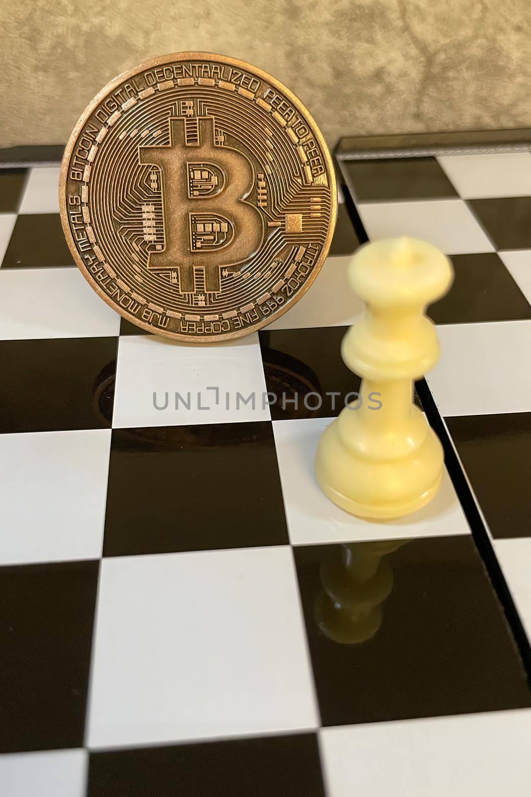 cryptocurrency mining. Close-up bitcoin coin and chess game by yilmazsavaskandag