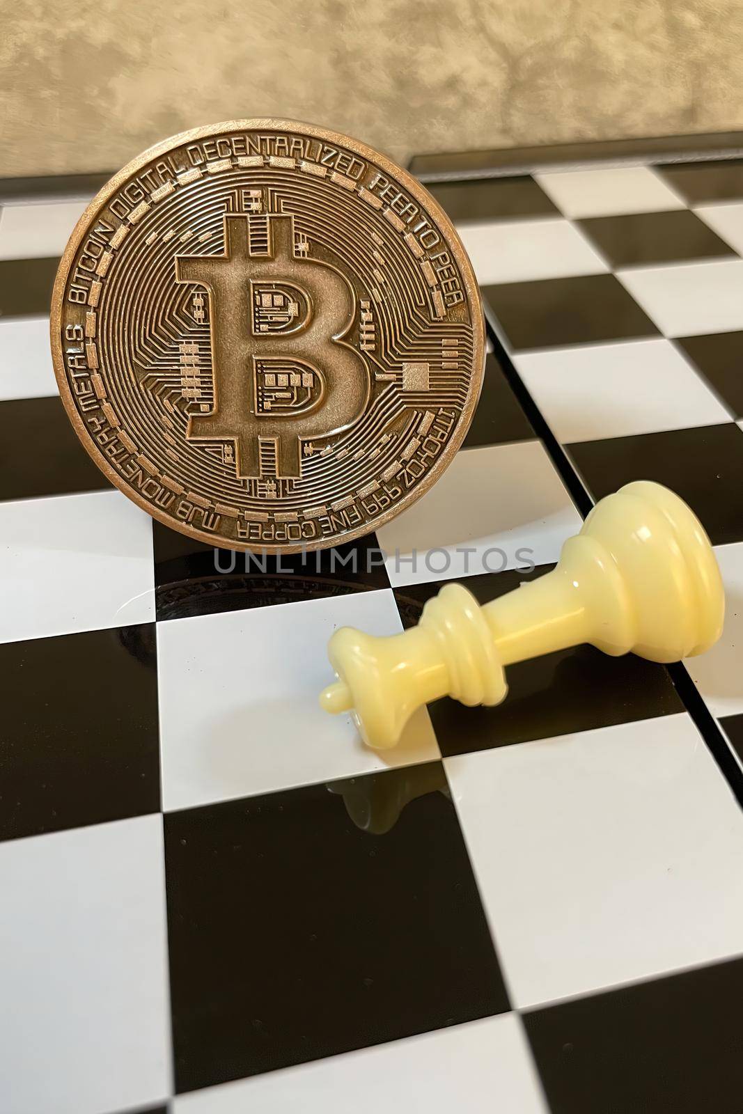 cryptocurrency mining. Close-up bitcoin coin and chess game by yilmazsavaskandag
